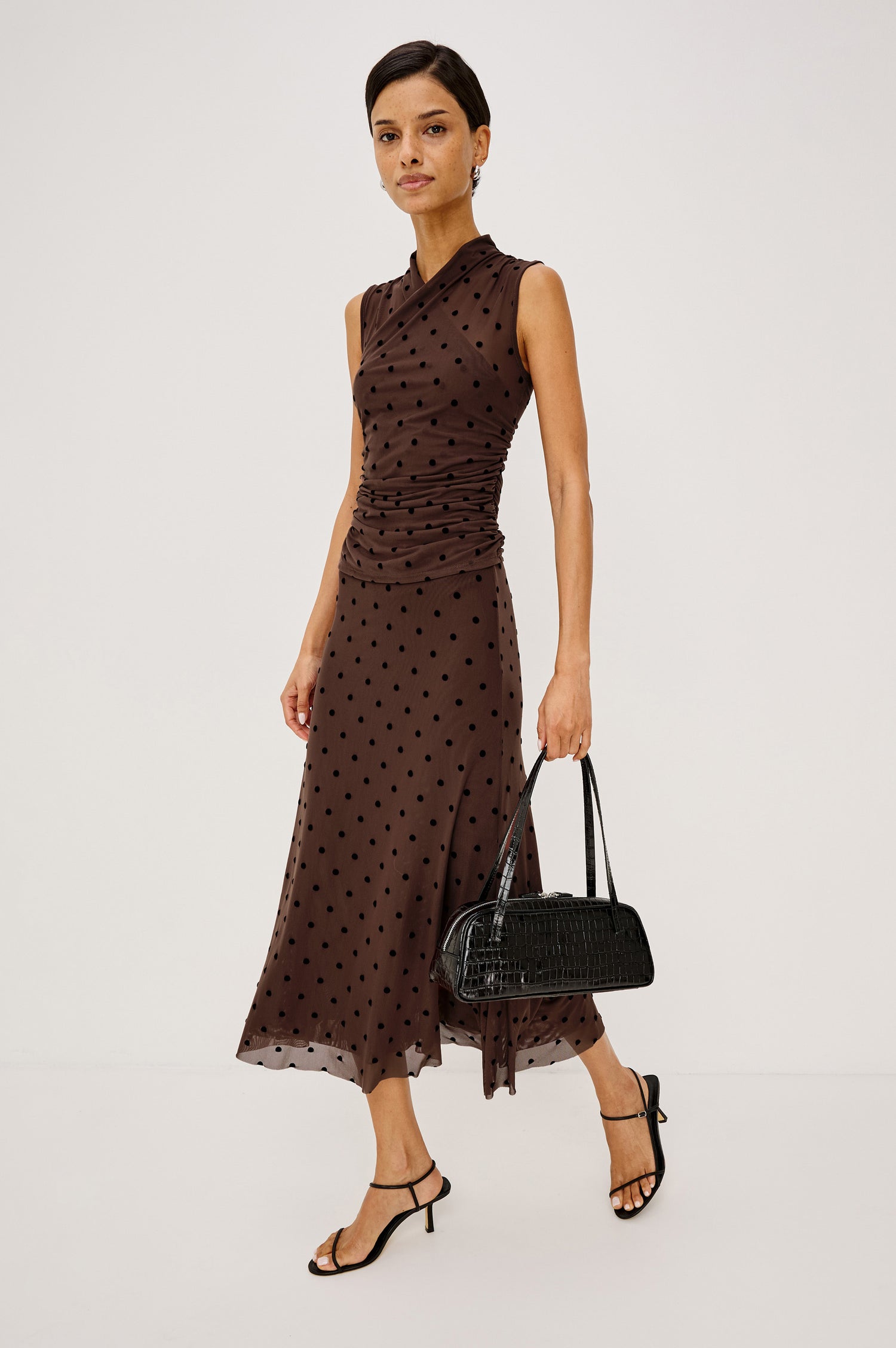 Lauris Top in Stretch Mesh With Wrap Neckline, Side Ruching, and Velvet Flocked Motifs in Chocolate Polka Dot Colorway - Full Body Front View Featured on Model