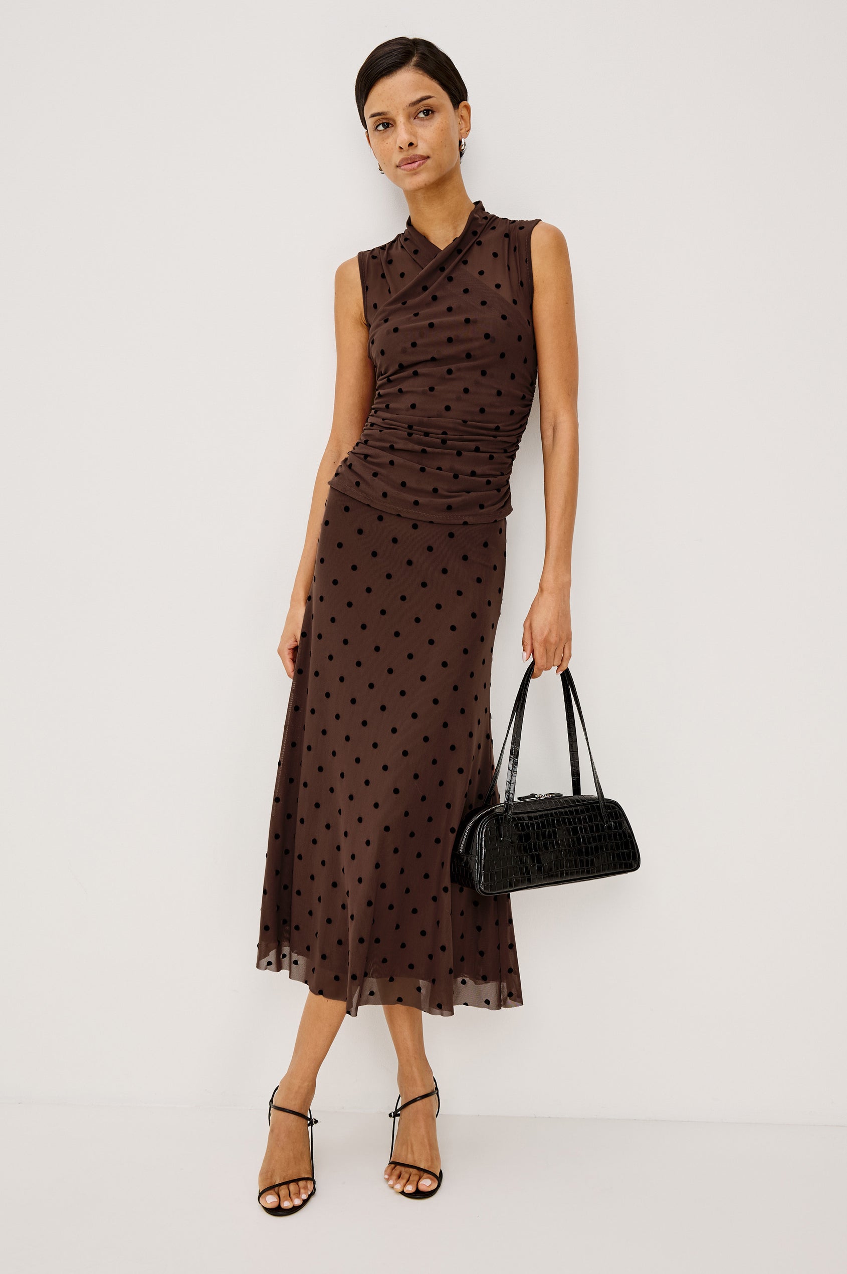 Lauris Top in Stretch Mesh With Wrap Neckline, Side Ruching, and Velvet Flocked Motifs in Chocolate Polka Dot Colorway - Full Body Front View Featured on Model