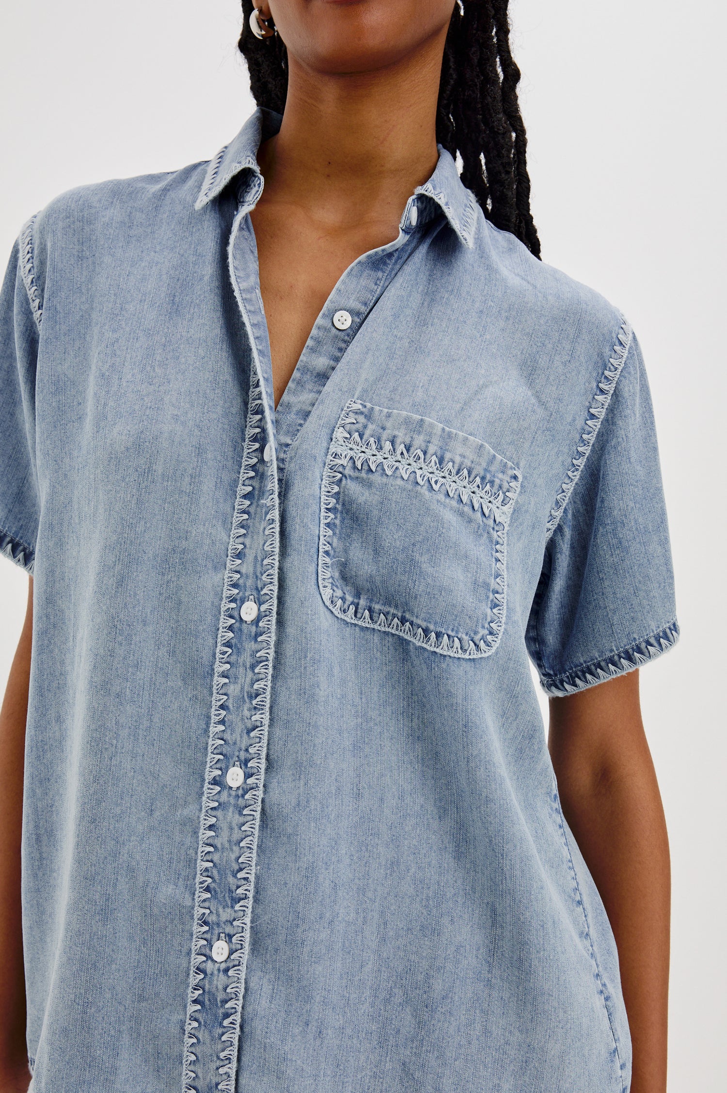 Lea Collared Button Front Shirt with Short Sleeves and a Front Chest Pocket in Medium Cloud Colorway. Front Detailed View Shown On Model.