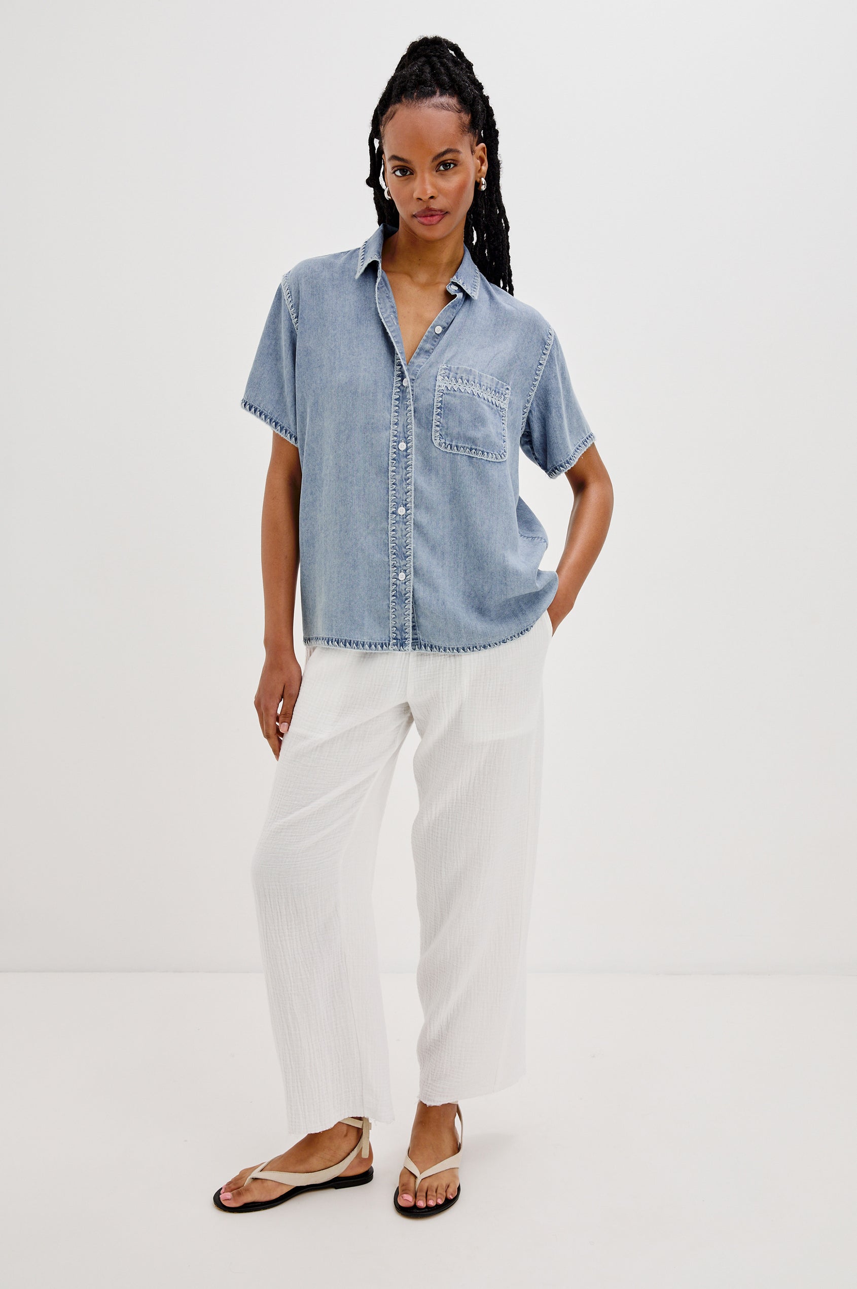 Lea Collared Button Front Shirt with Short Sleeves and a Front Chest Pocket in Medium Cloud Colorway. Full Body Front View Shown On Model.