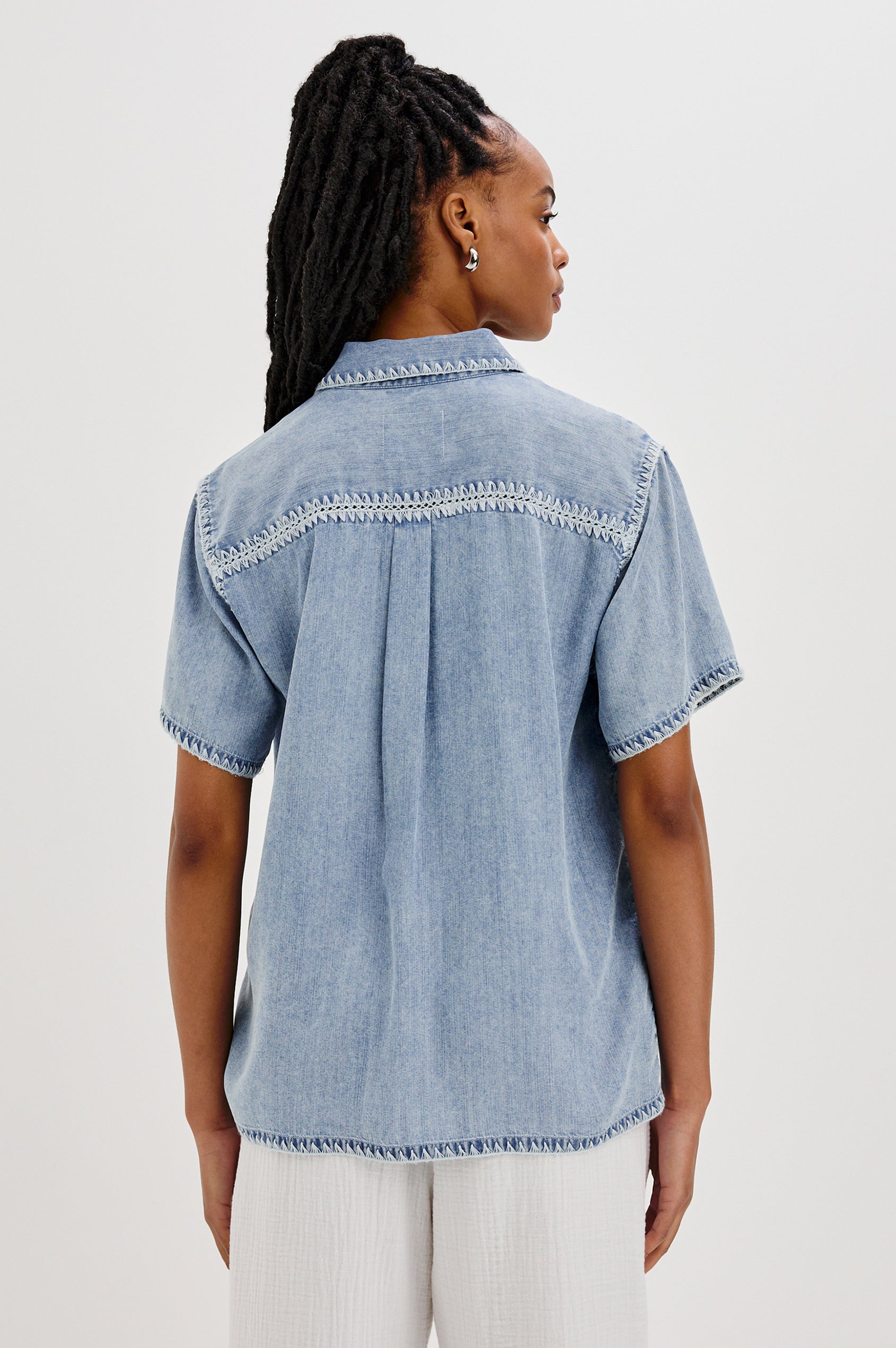 Lea Collared Button Front Shirt with Short Sleeves and a Front Chest Pocket in Medium Cloud Colorway. Back View Shown On Model.