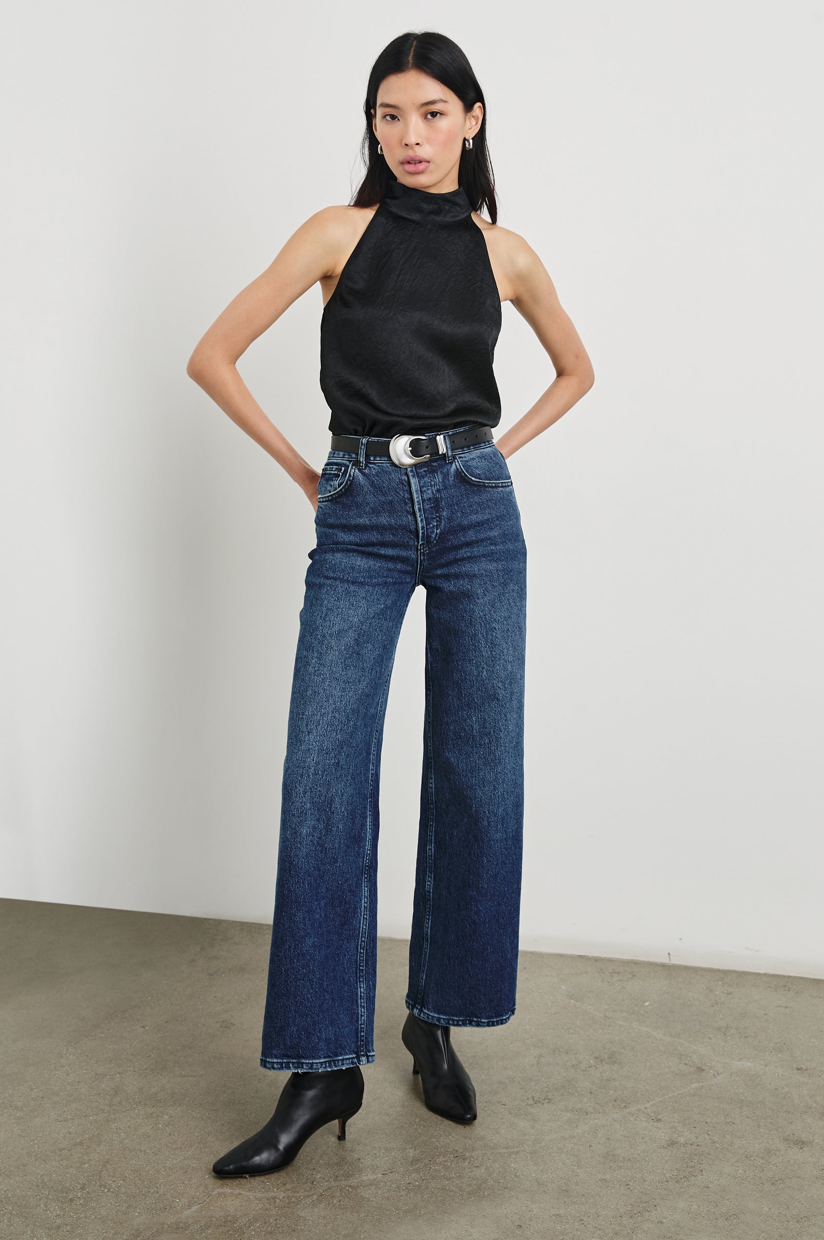 Leah Top with High Neck Halter Top with Back Button Closure in Black Crinkle Colorway - Front Tucked Full Body View Featured on Model