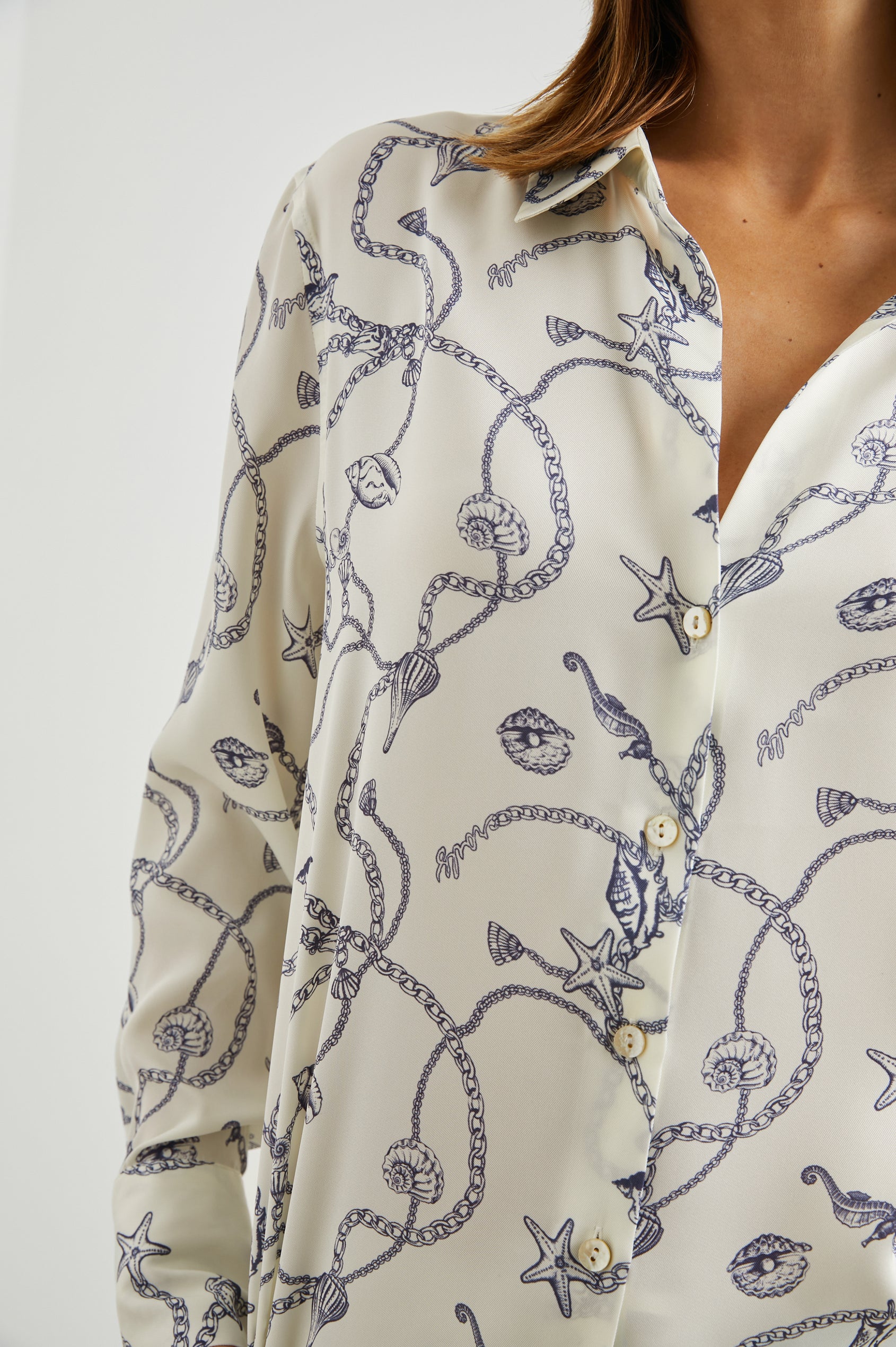 Ledger Long-Sleeve Button Down in Nautical Chain Colorway, a blue nautical design on ivory - Front View Featured on Model