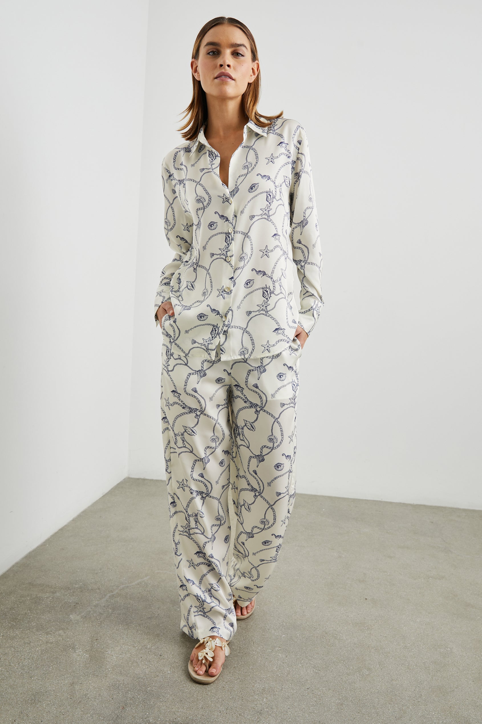 Ledger Long-Sleeve Button Down in Nautical Chain Colorway, a blue nautical design on ivory - Front Full Body View Featured on Model