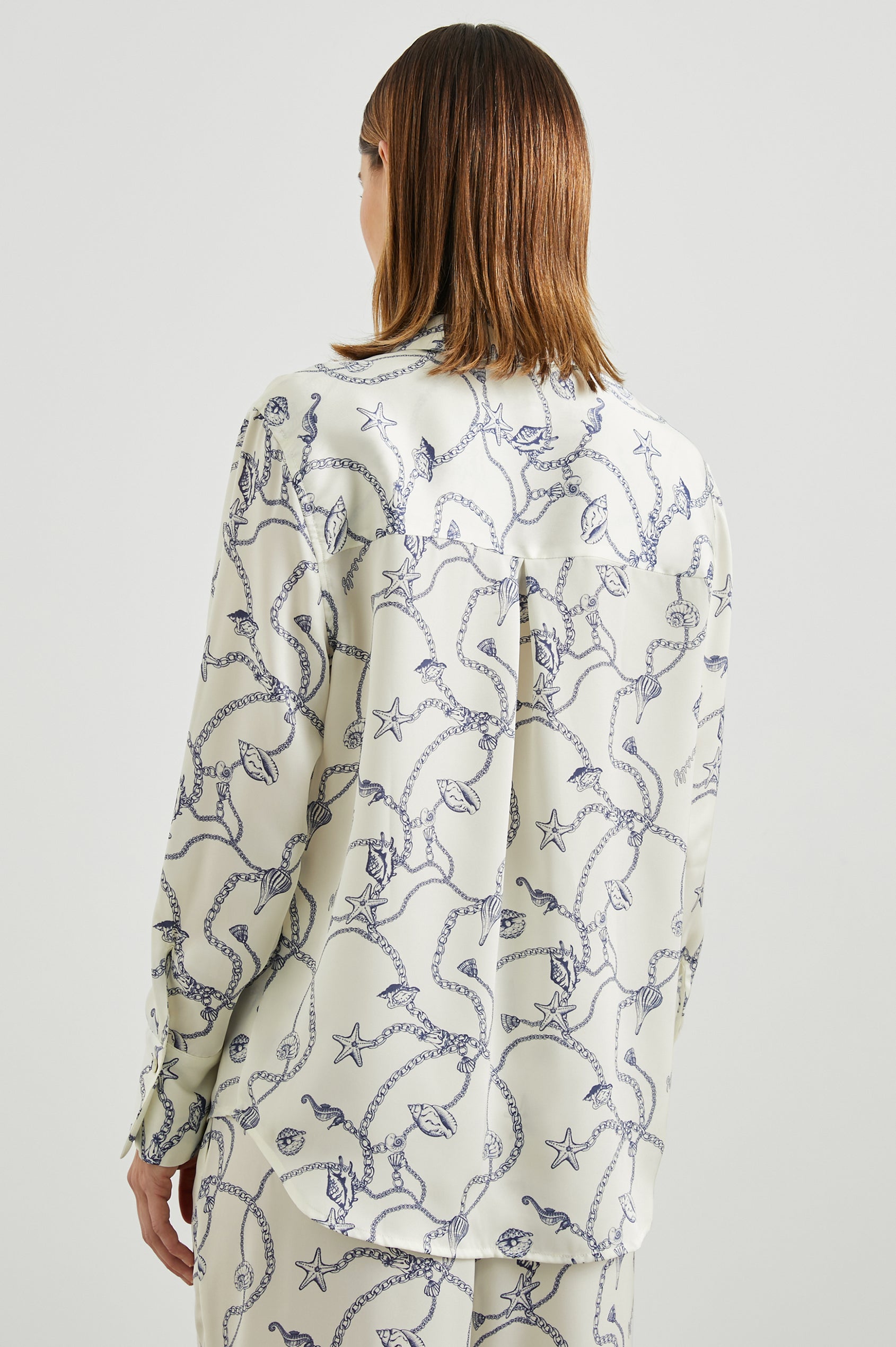 Ledger Long-Sleeve Button Down in Nautical Chain Colorway, a blue nautical design on ivory - Back View Featured on Model