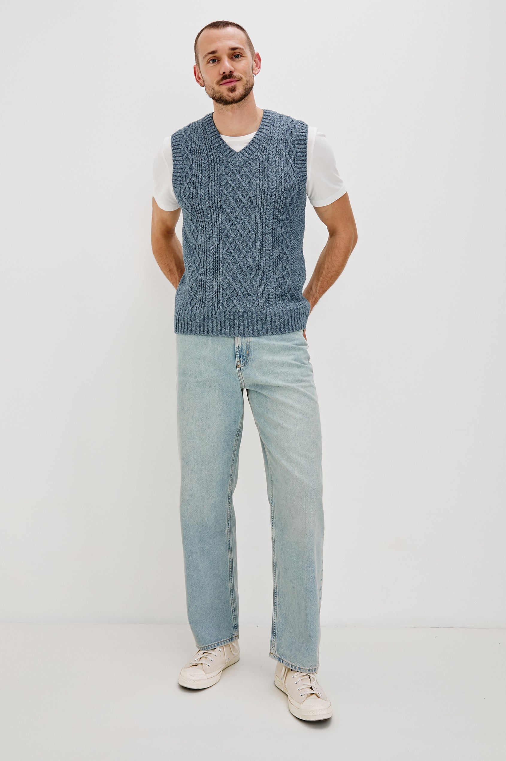 Lee V-Neck Sweater Vest, Cable Knit, Rib Collar, Sleeve Opening and Hem in Azure Marl Colorway. Full Body Front View Shown on Model.