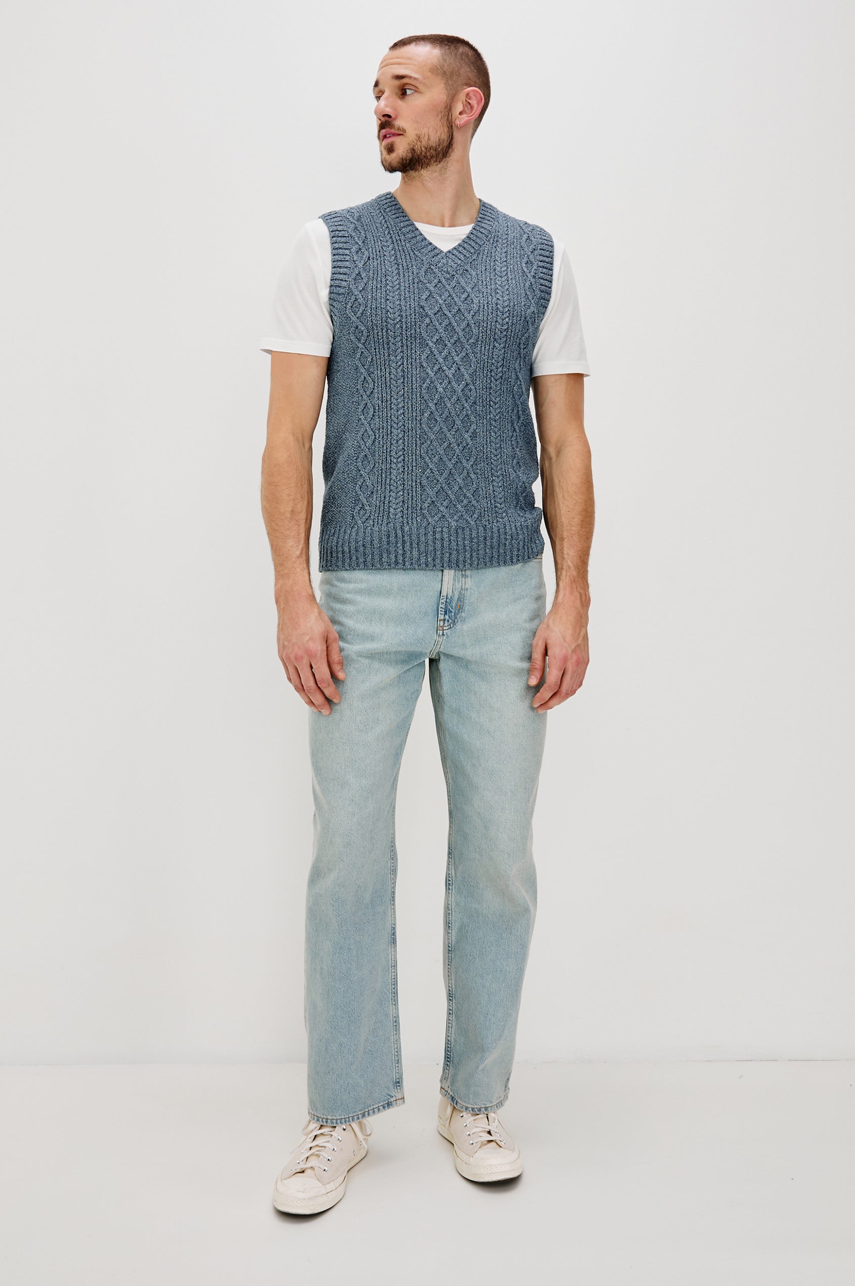 Lee V-Neck Sweater Vest, Cable Knit, Rib Collar, Sleeve Opening and Hem in Azure Marl Colorway. Full Body Front View Shown on Model.