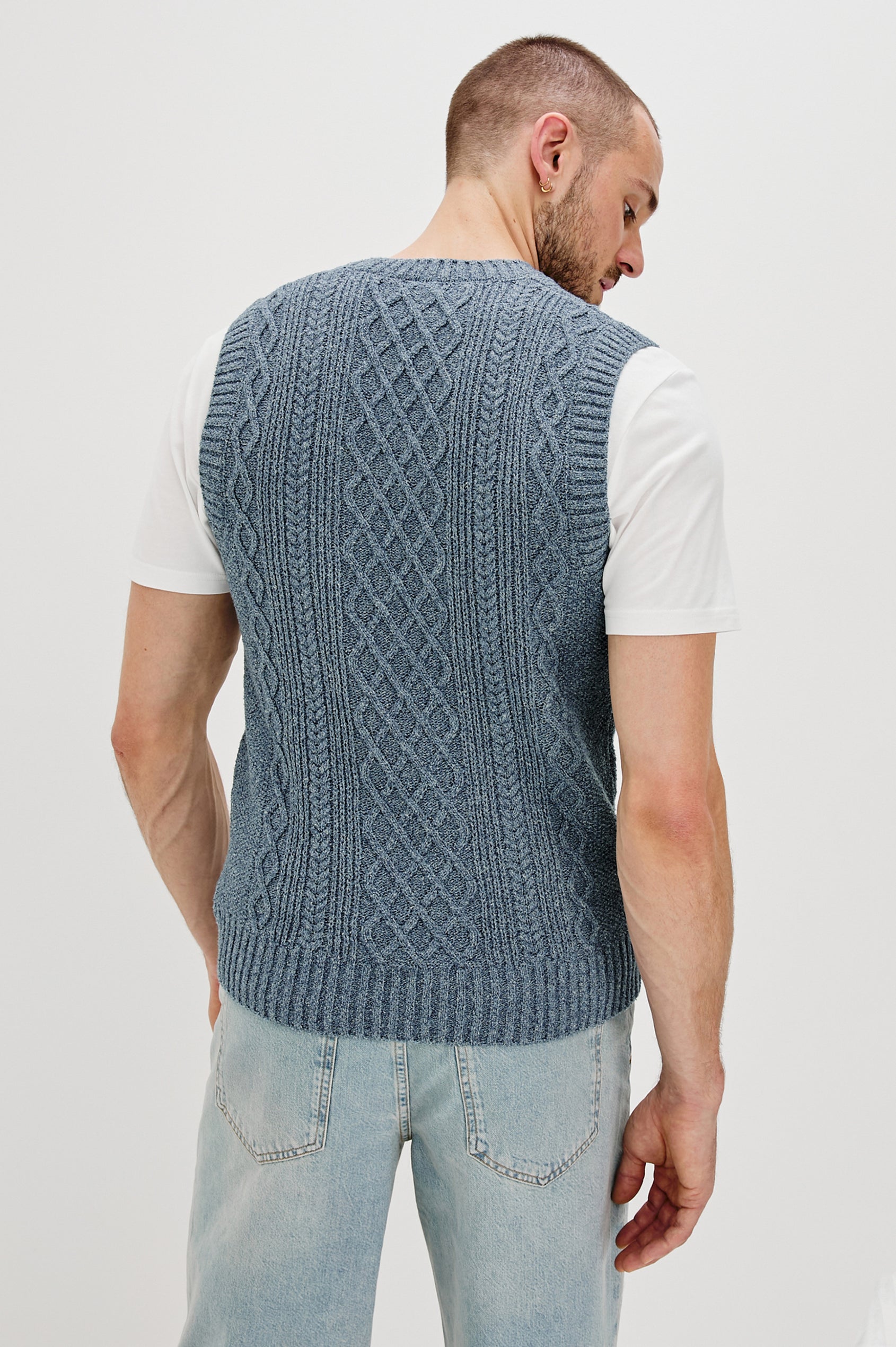 Lee V-Neck Sweater Vest, Cable Knit, Rib Collar, Sleeve Opening and Hem in Azure Marl Colorway. Back Detail View Shown on Model.