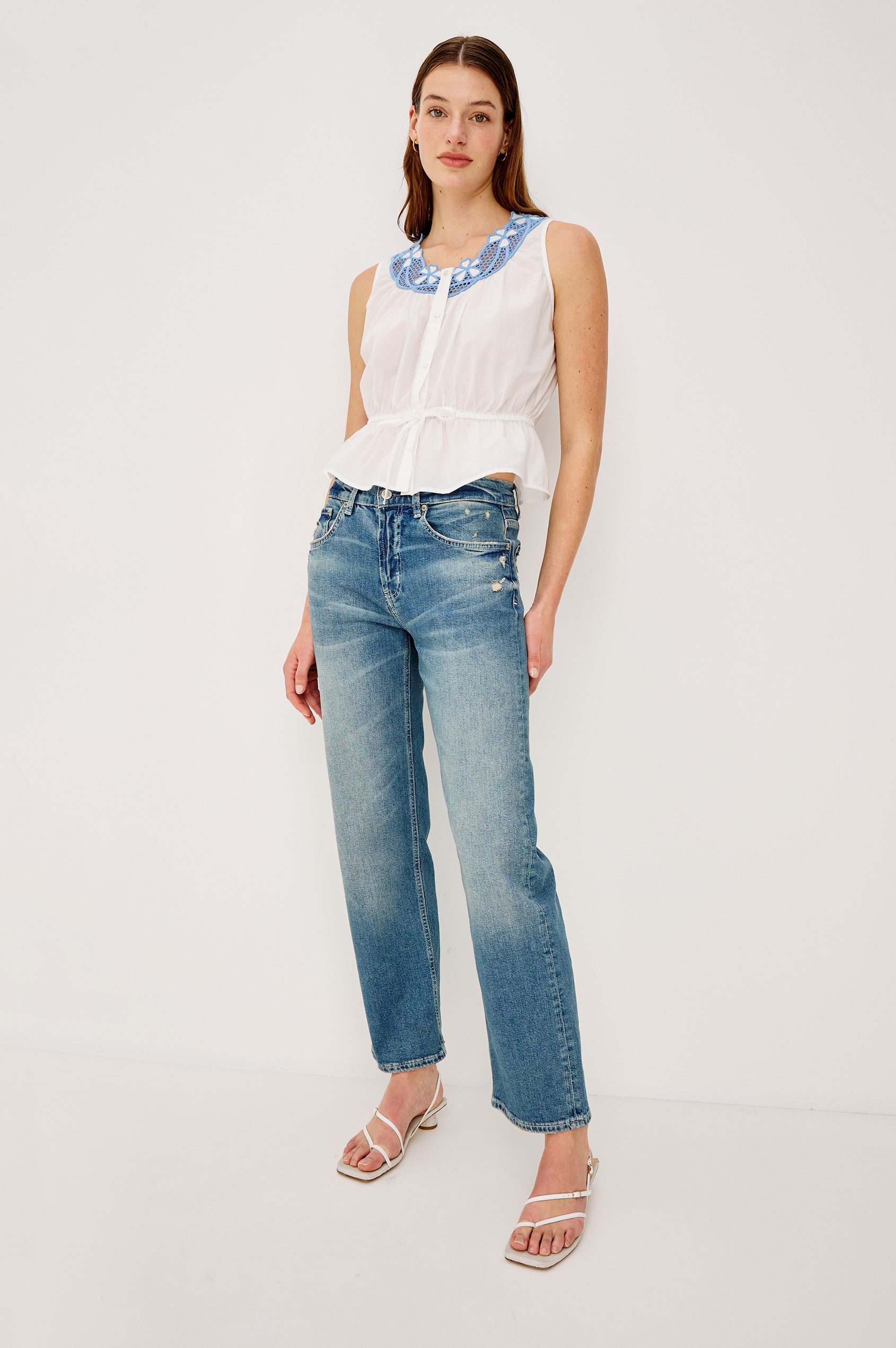 Leilani Top in Lightweight Beach Cotton With Scoop Neckline Contrast Lattice Embroidery Front Buttons Relaxed Fit and Adjustable Waist Ties in White Colorway - Full Body Front View Featured on Model