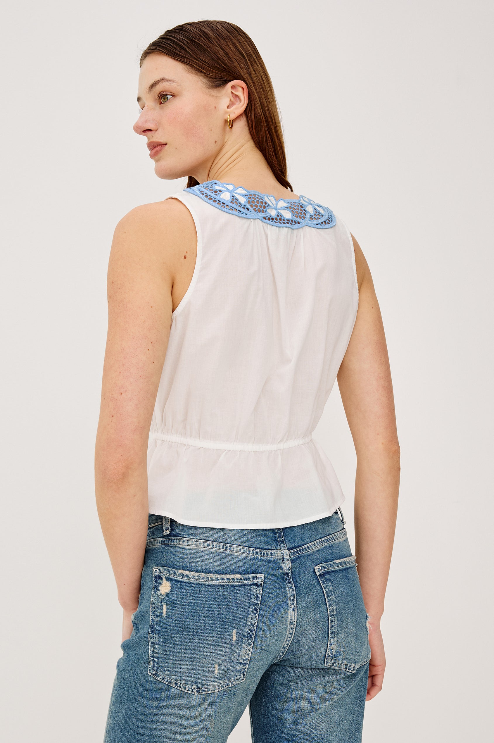 Leilani Top in Lightweight Beach Cotton With Scoop Neckline Contrast Lattice Embroidery Front Buttons Relaxed Fit and Adjustable Waist Ties in White Colorway - Upper Body Back View Featured on Model