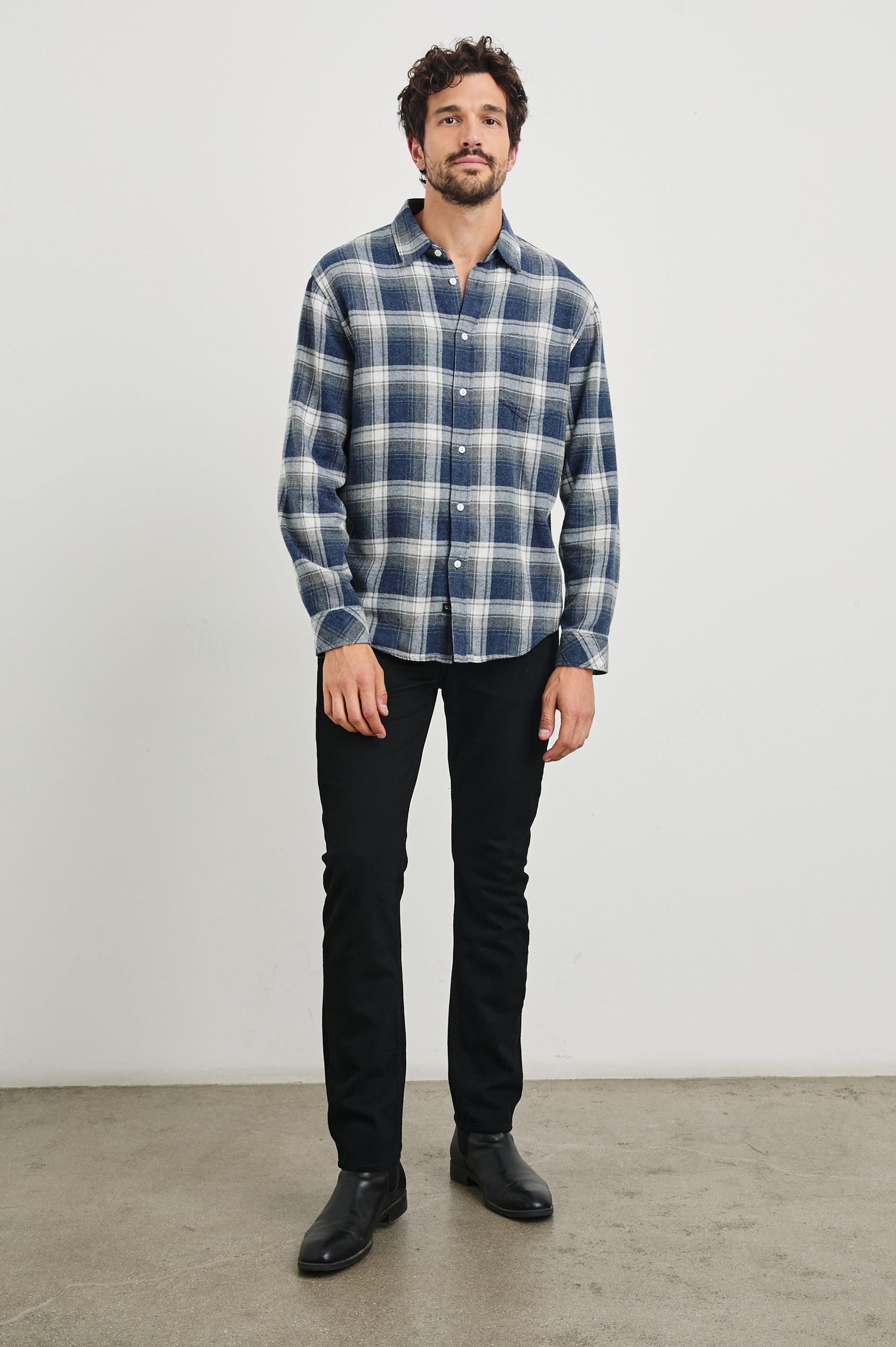 Lennox Long-Sleeve Button Up with a Chest Patch Pocket in Charcoal Lapis Colorway, a plaid in Charcoal, Lapis and White - Front Full Body View Featured on model