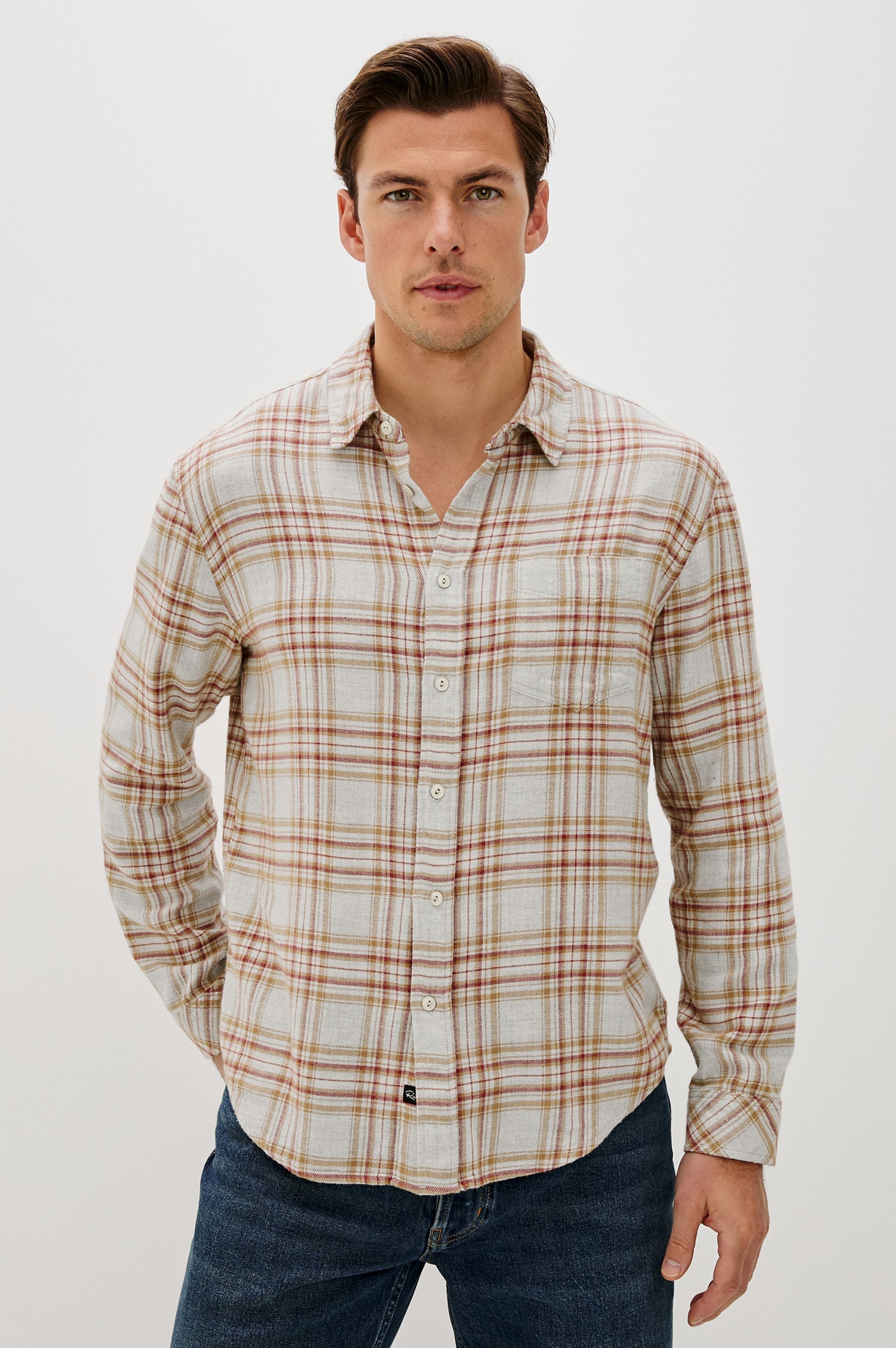 Lennox Long-Sleeve Button Up with a Chest Patch Pocket in Currant Tawney Melange Colorway, a plaid wtih Beige, Burnt Orange and gold colors- Front Seated View Featured on model
