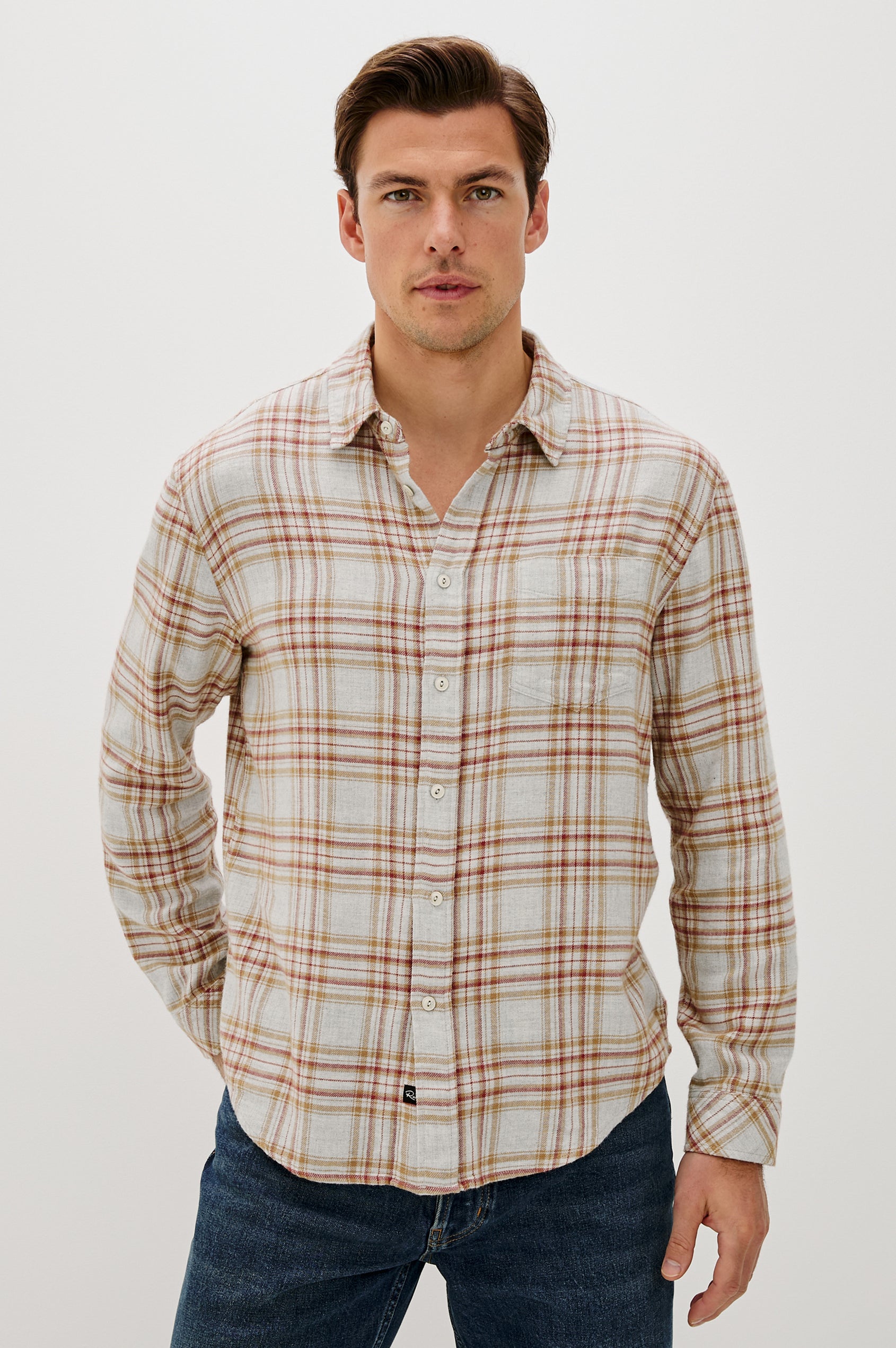 Lennox Long-Sleeve Button Up with a Chest Patch Pocket in Currant Tawney Melange Colorway, a plaid wtih Beige, Burnt Orange and gold colors- Front Seated View Featured on model