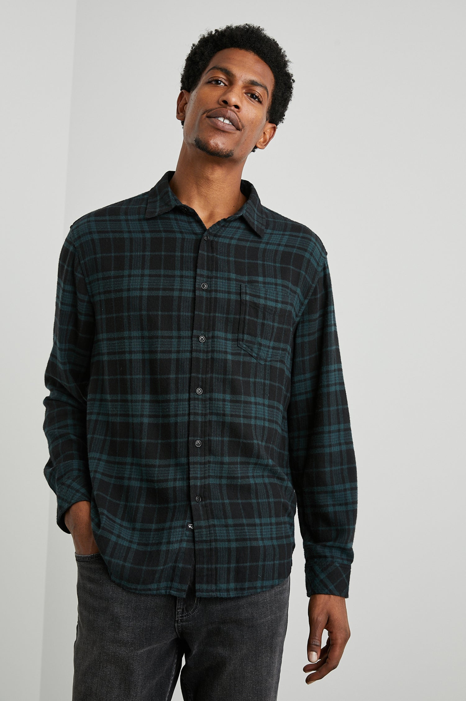 Lennox Long-Sleeve Button Up with a Chest Patch Pocket in Emerald Shadow Colorway, a plaid in Emerald and Black - Front View Featured on Model