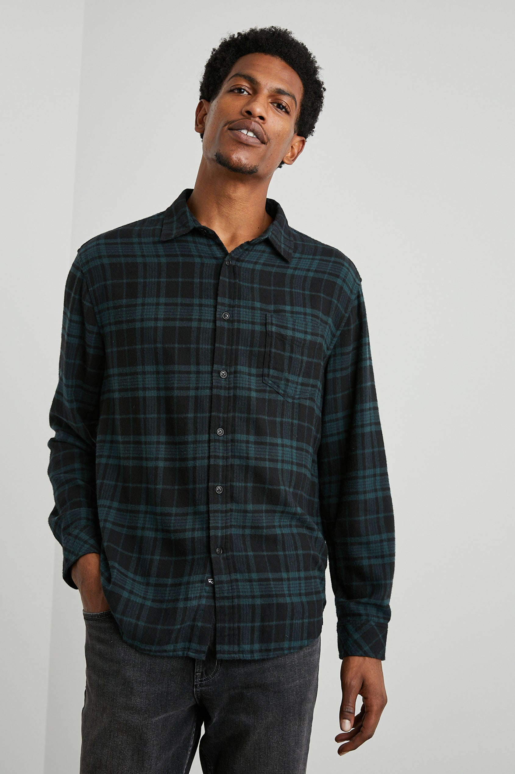 Lennox Long-Sleeve Button Up with a Chest Patch Pocket in Emerald Shadow Colorway, a plaid in Emerald and Black - Front View Featured on Model