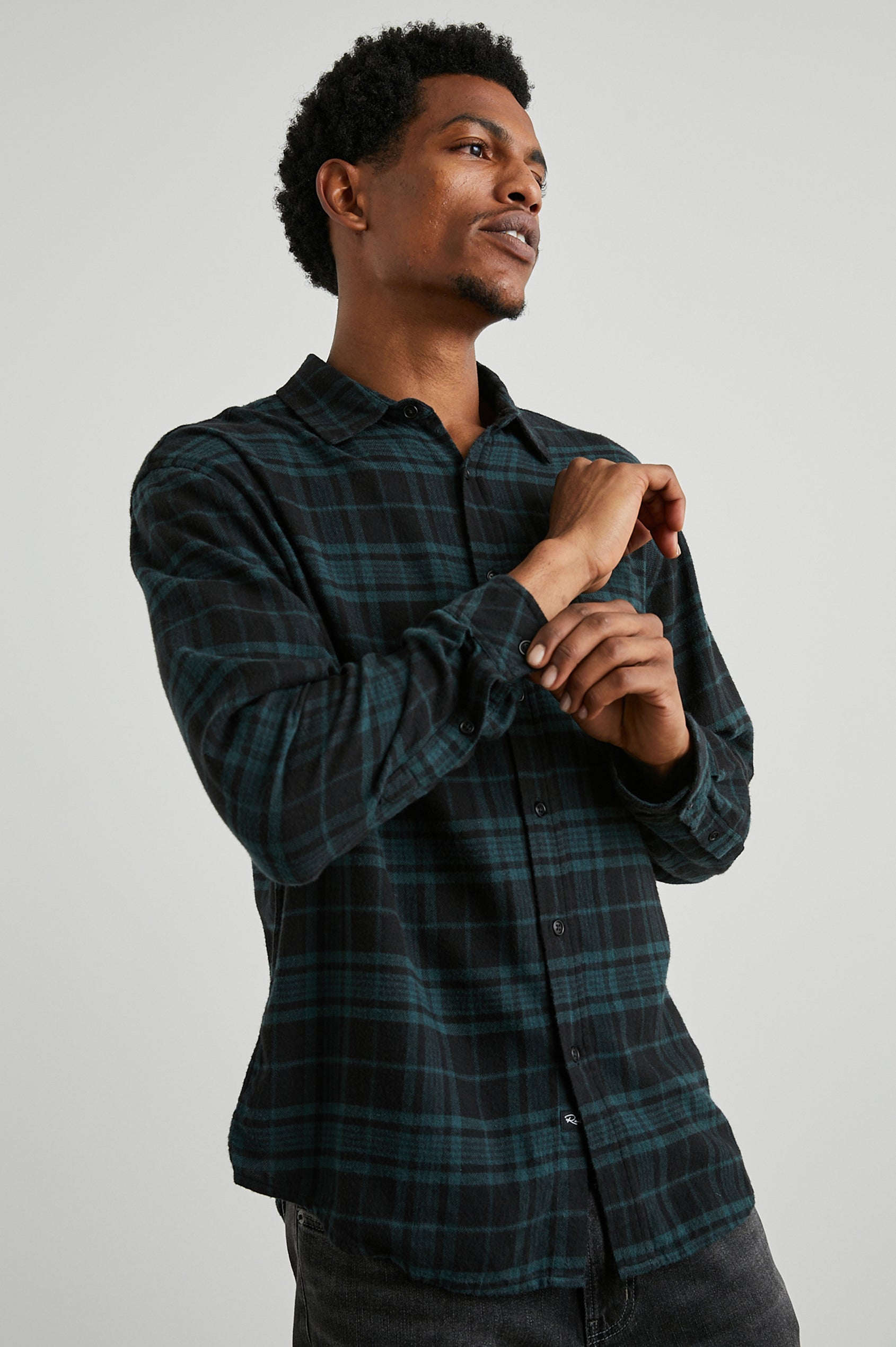 Lennox Long-Sleeve Button Up with a Chest Patch Pocket in Emerald Shadow Colorway, a plaid in Emerald and Black - Front View Featured on Model