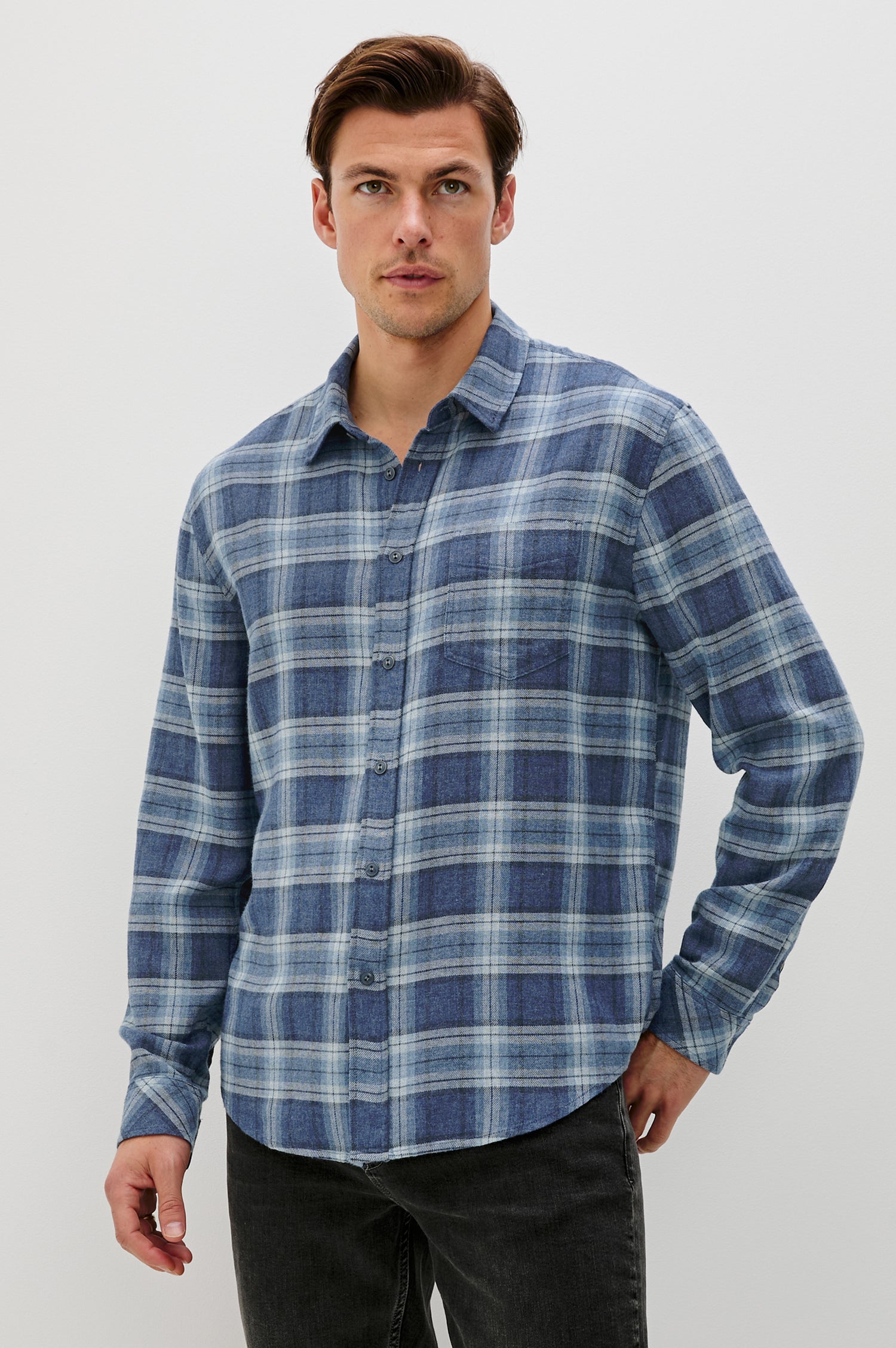 Lennox Long-Sleeve Button Up with a Chest Patch Pocket in Inkwell Melange Colorway, a plaid wtih dark and light blues - Front View Featured on model