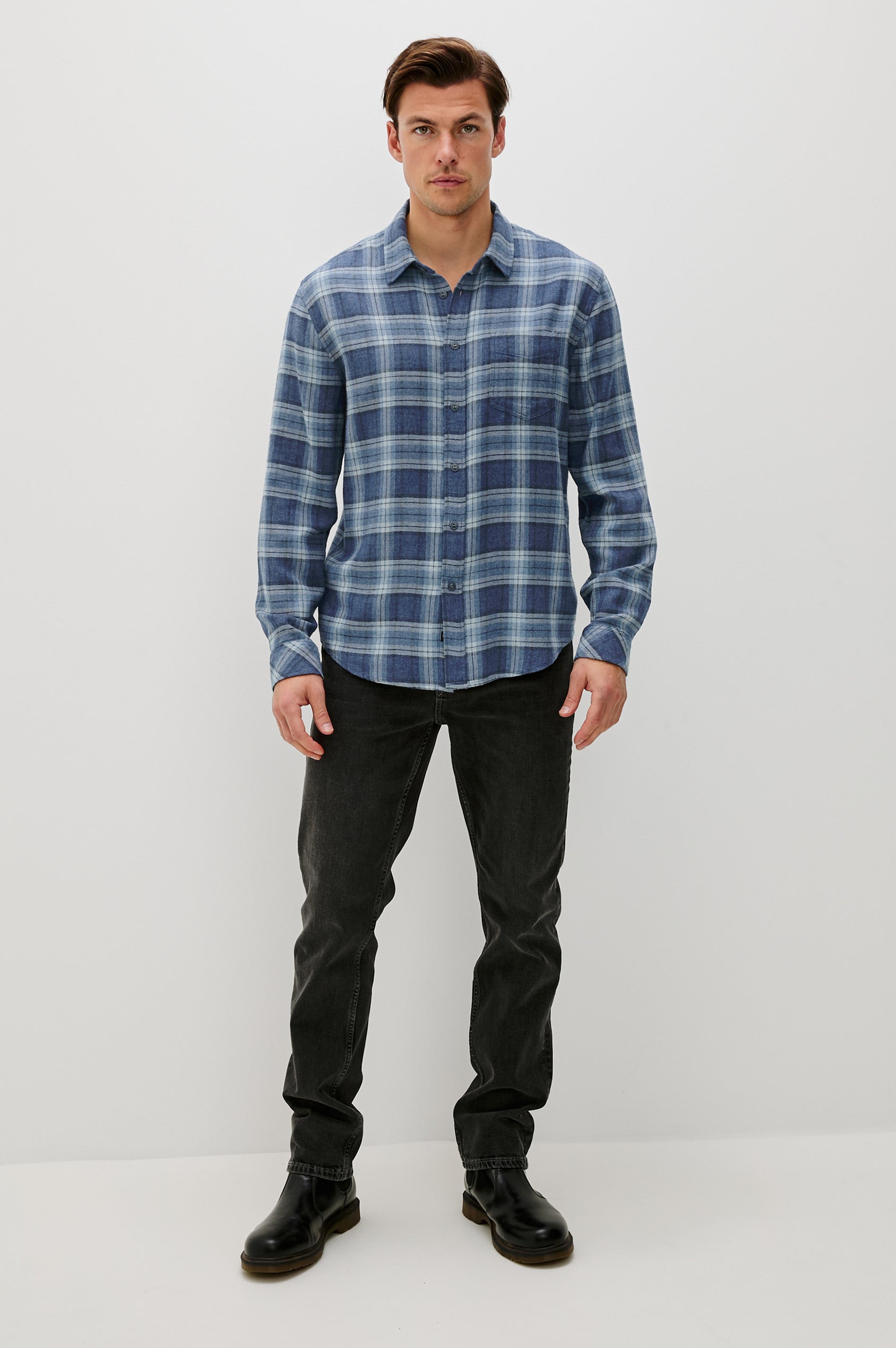 Lennox Long-Sleeve Button Up with a Chest Patch Pocket in Inkwell Melange Colorway, a plaid wtih dark and light blues - Front Full Body View Featured on model