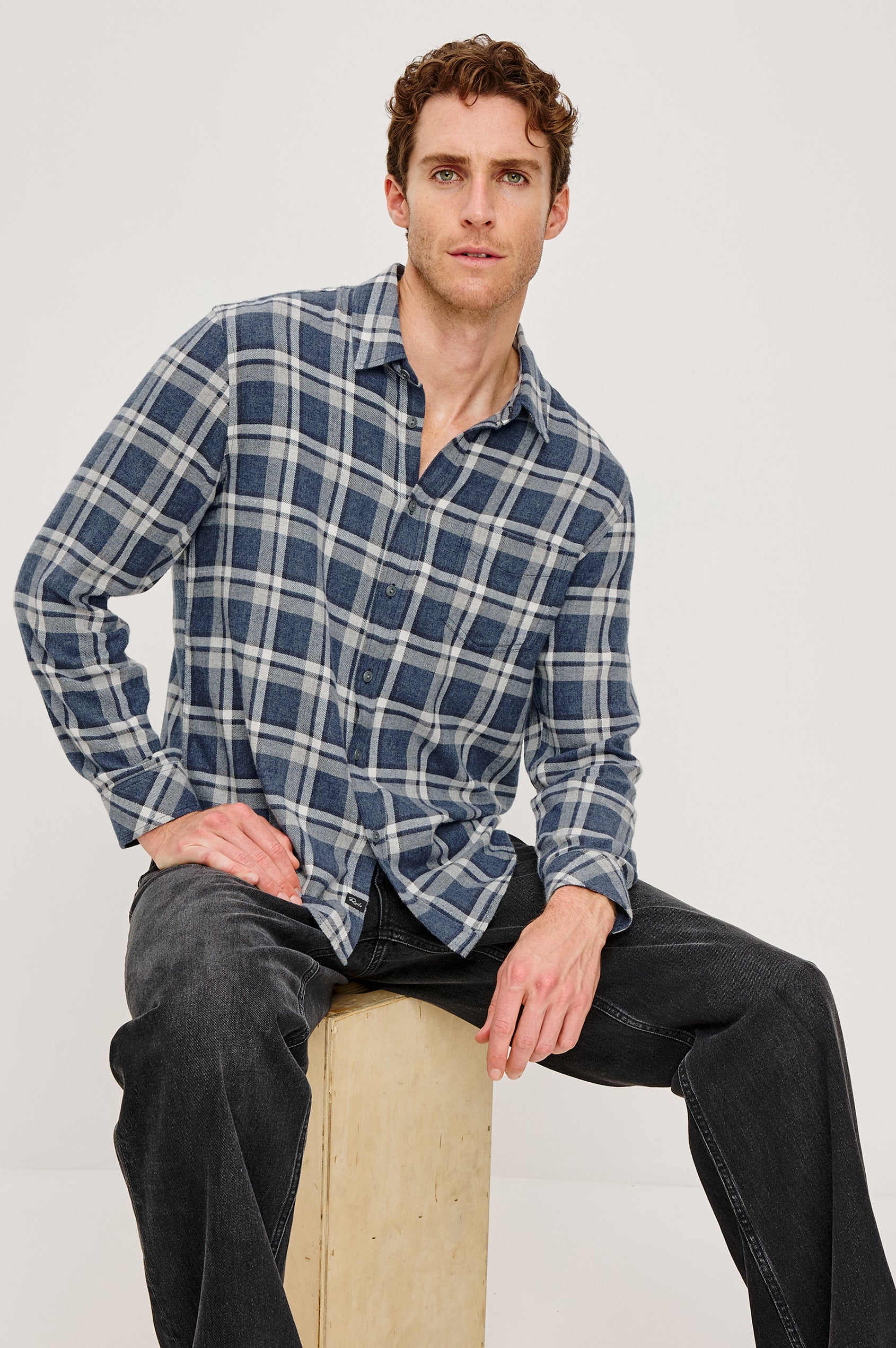 Lennox Long-Sleeve Button Up with a Chest Patch Pocket in Nocturen Shimmer Colorway. Front Seated View Featured on model.