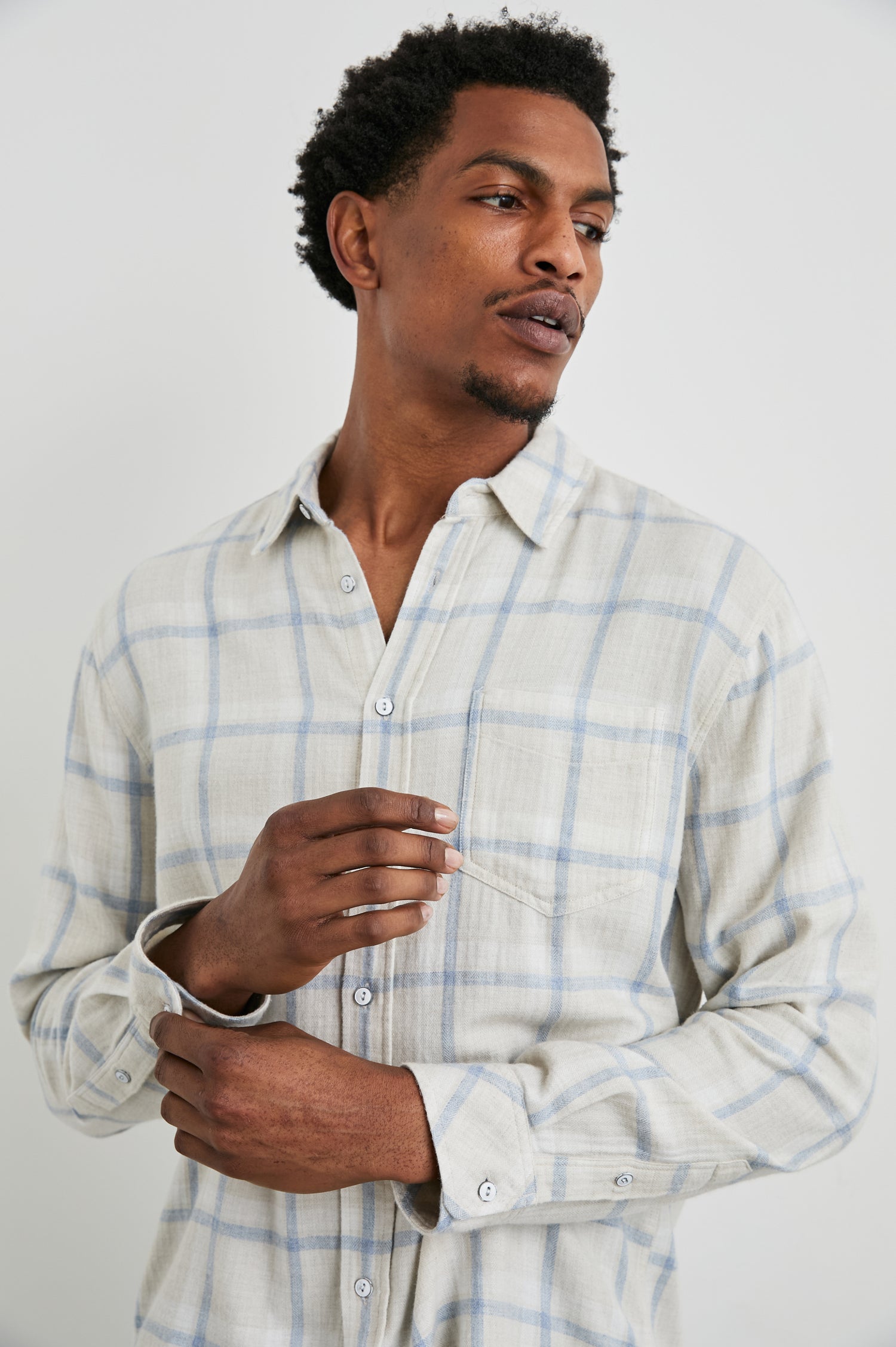 Lennox Long-Sleeve Button Up with a Chest Patch Pocket in Parchment Sky Melange Colorway, a plaid - Front View Featured on Model