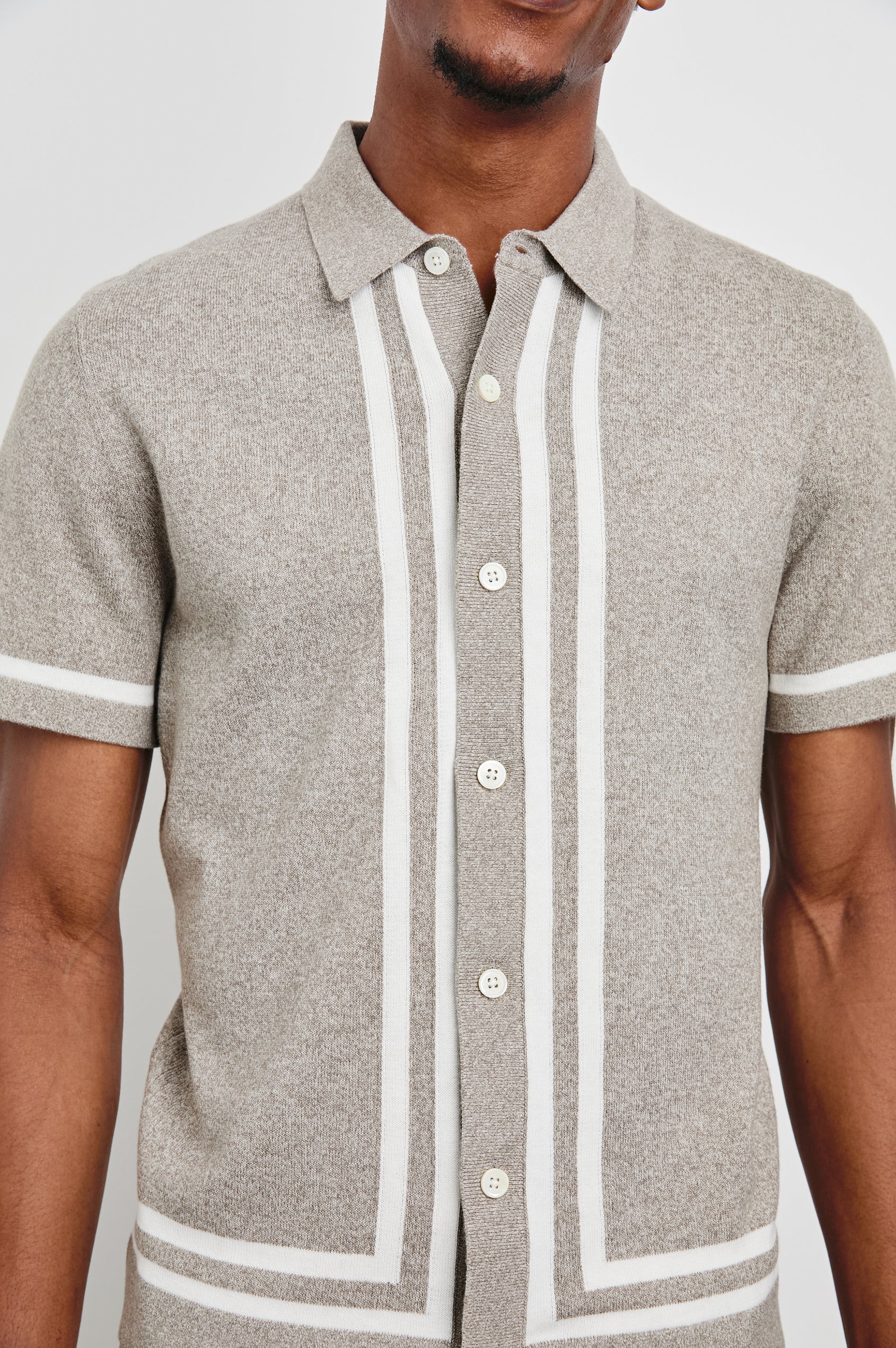 Leo Short-Sleeve Button Up in Oat Grey Melange Colorway, with white bands along the buttons and trim - Front View Featured on Model