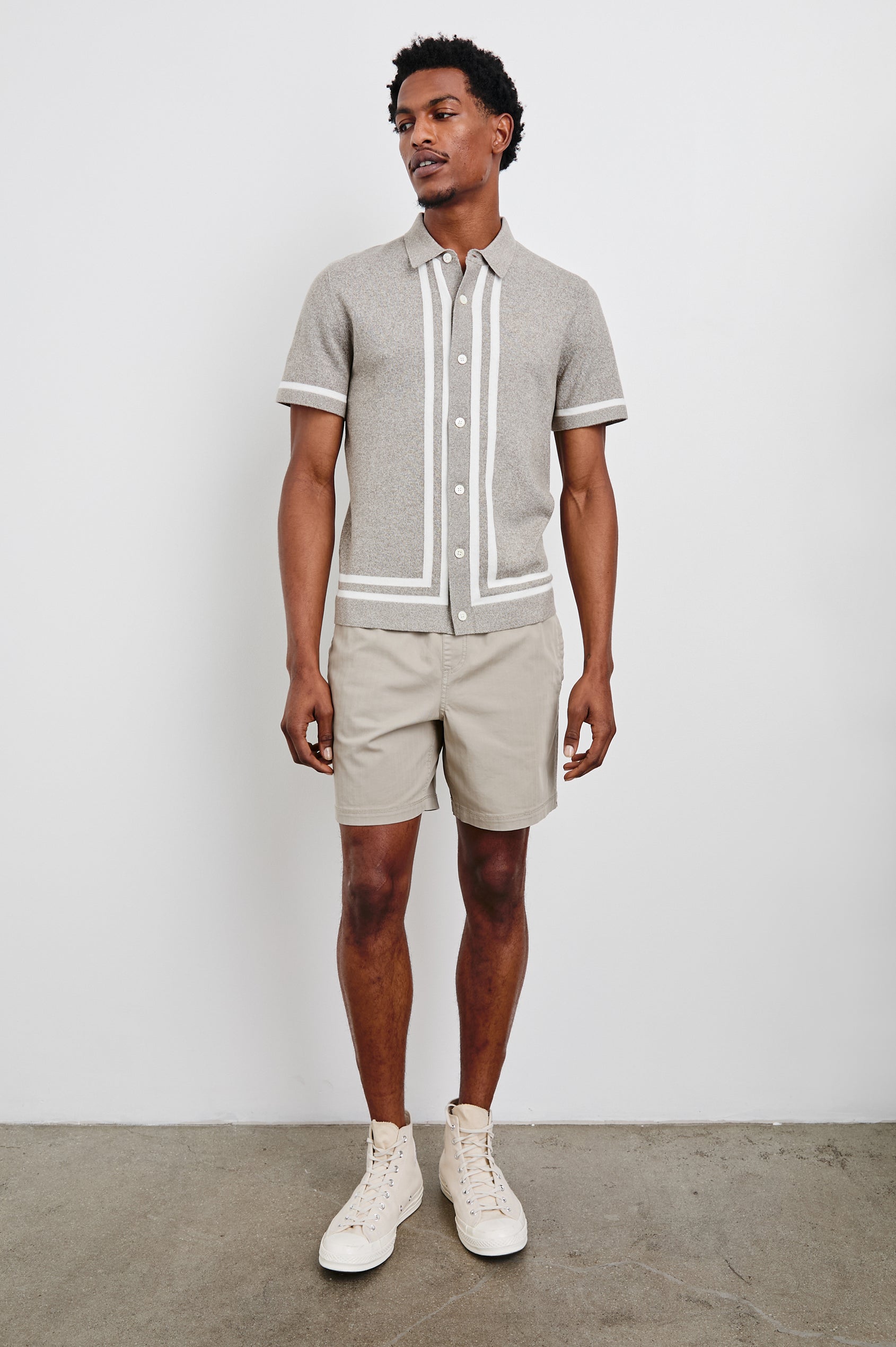 Leo Short-Sleeve Button Up in Oat Grey Melange Colorway, with white bands along the buttons and trim - Front Full Body View Featured on Model