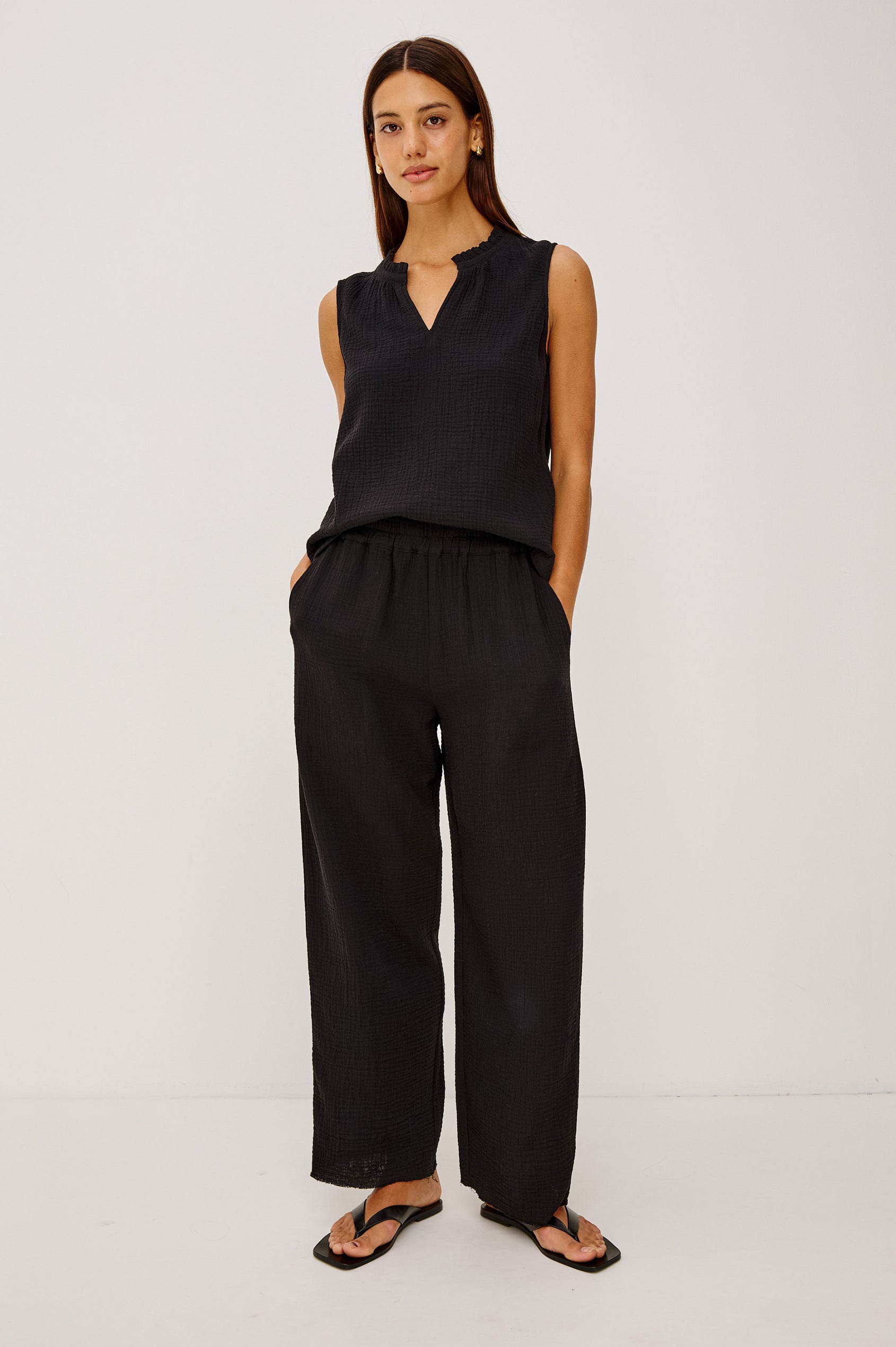 Leon Crop Cotton Gauze Pant With Hemline Slit And Elastic Waist In Colorway Black - Front View Featured On Model