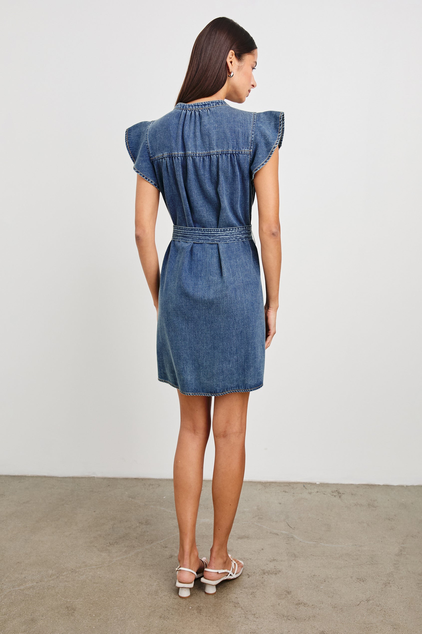 Letta Above-Knee Dress with Flutter Sleeves, Snaps down the Front, and a Belted Waist in Classic Blue Colorway - Back Full Body View Featured on Model 