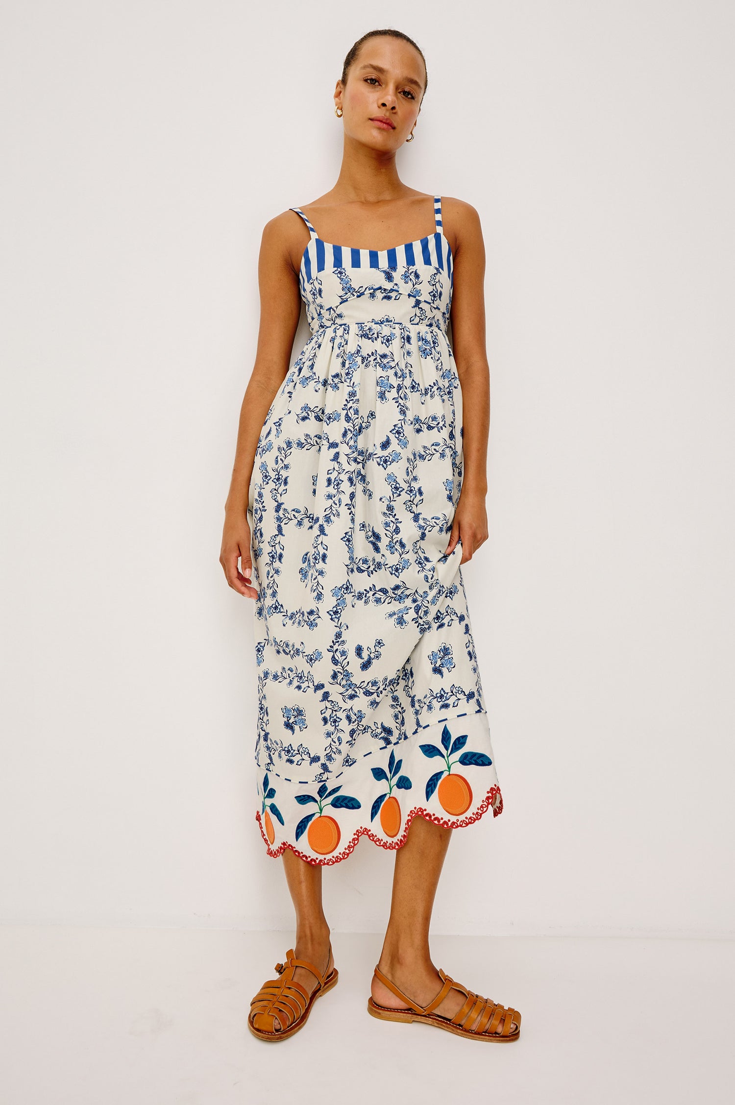 Lexie Maxi Dress in Cotton Poplin With Adjustable Shoulder Straps, Empire Waist, Piped Detailing, Orange Embroidery and Eyelet Hem, and is Fully Lined -