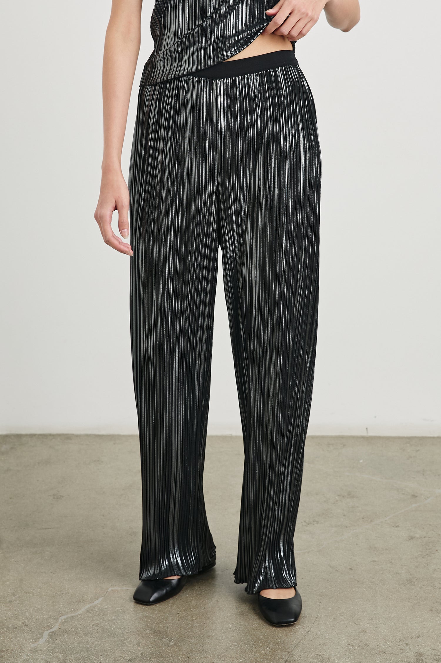 Liana Micro-Pleated Pants with an Elastic Waist in Gunmetal Colorway, Thin black, white and grey Vertical Stripes - Front View Featured on Model 