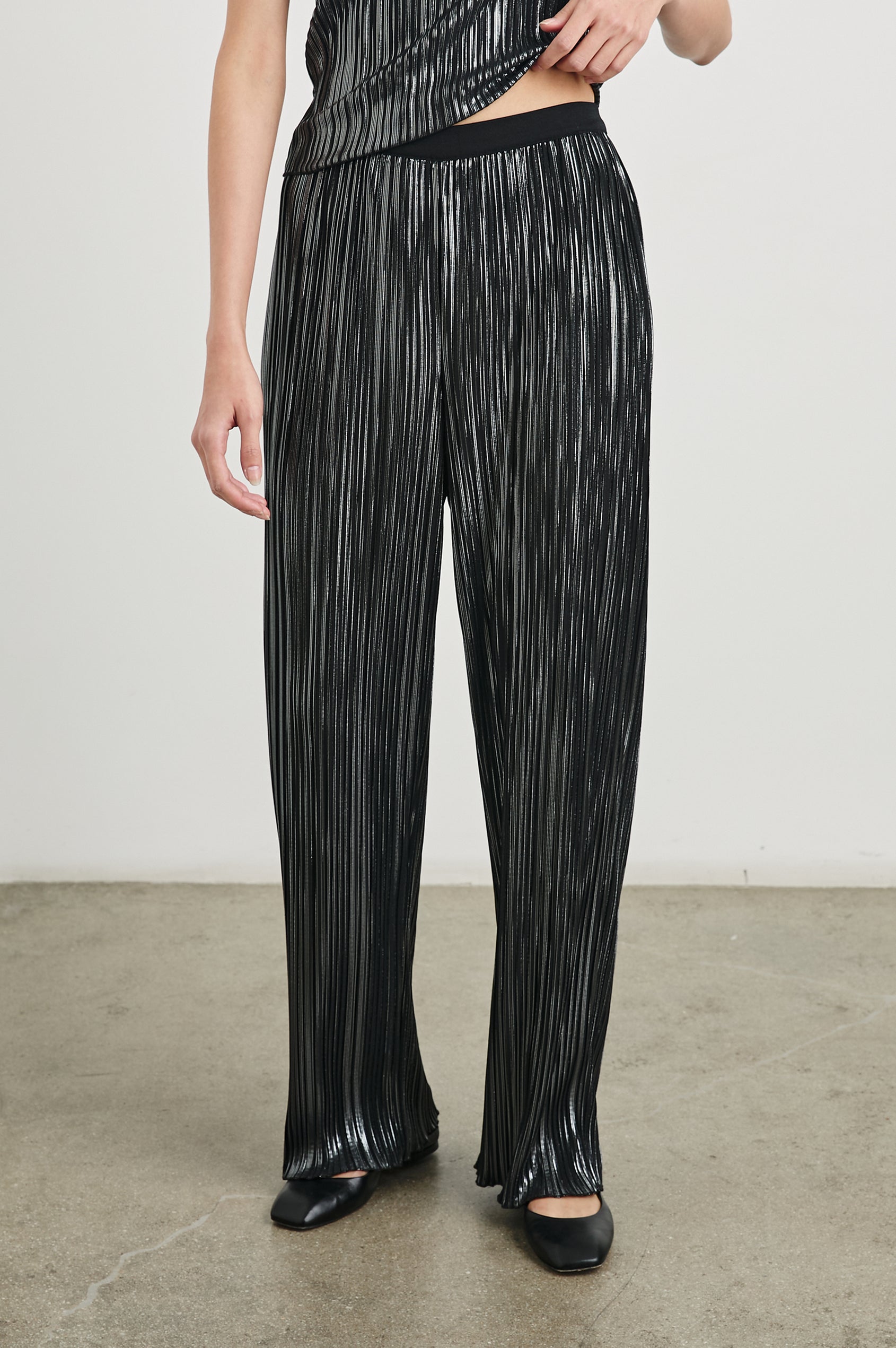 Liana Micro-Pleated Pants with an Elastic Waist in Gunmetal Colorway, Thin black, white and grey Vertical Stripes - Front View Featured on Model 
