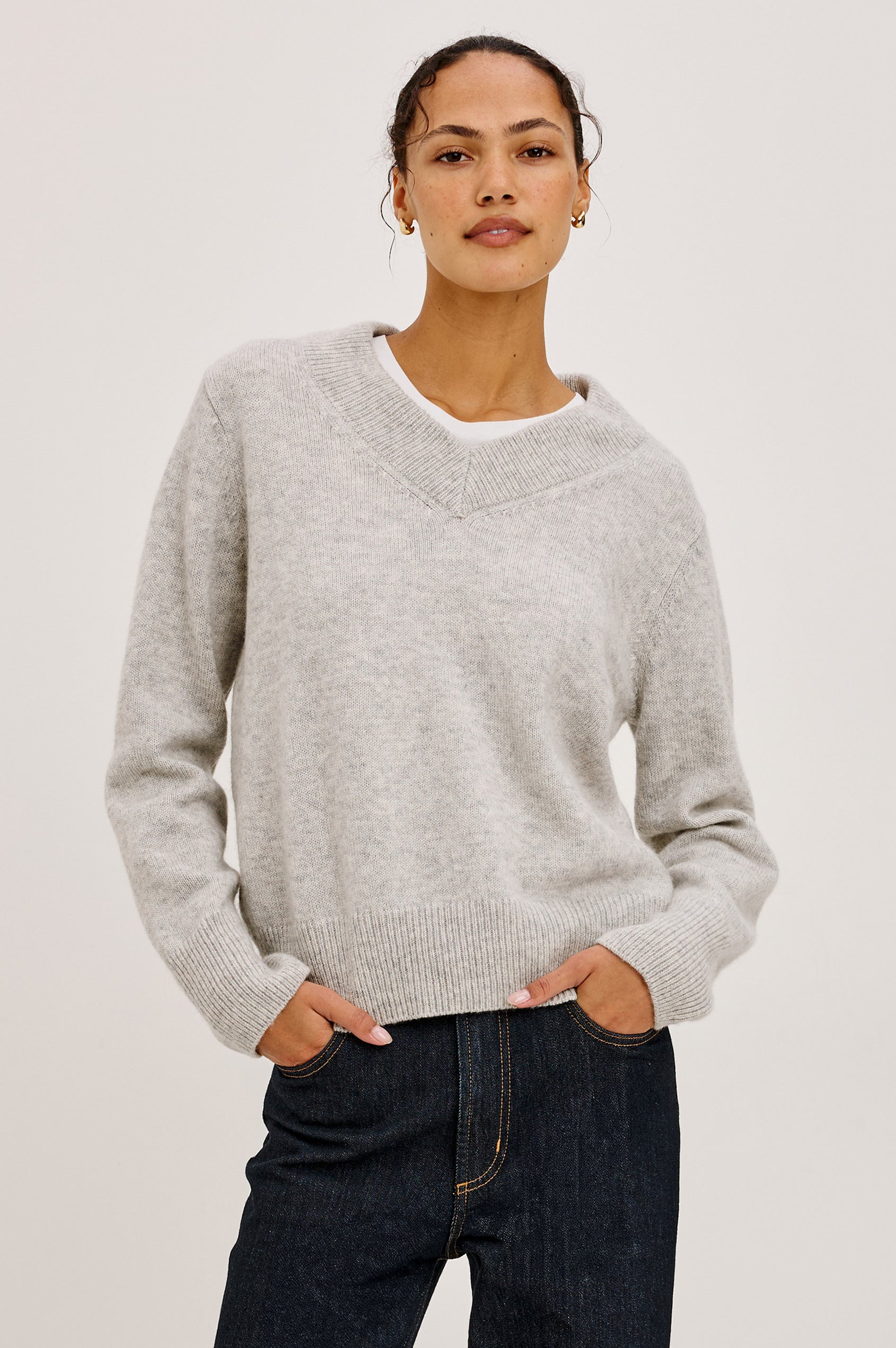 Lidya Sweater in Wool-Cashmere Knit Blend With V-Neckline, Loose Relaxed Fit, Long Sleeves, and Ribbed Trim in Heather Grey Colorway - Upper Body Front View Featured on Model