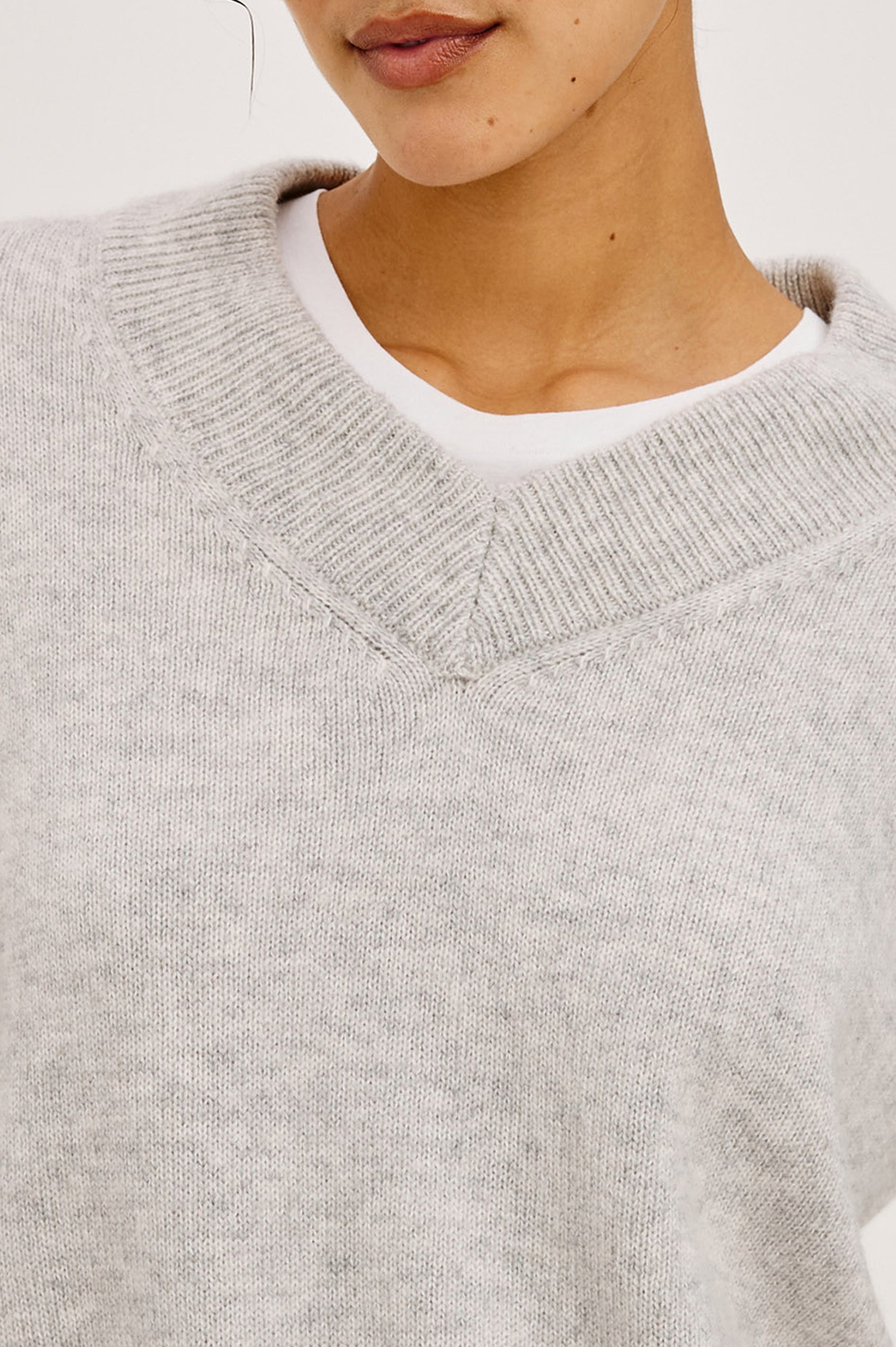 Lidya Sweater in Wool-Cashmere Knit Blend With V-Neckline, Loose Relaxed Fit, Long Sleeves, and Ribbed Trim in Heather Grey Colorway - Upper Body Front View Featured on Model