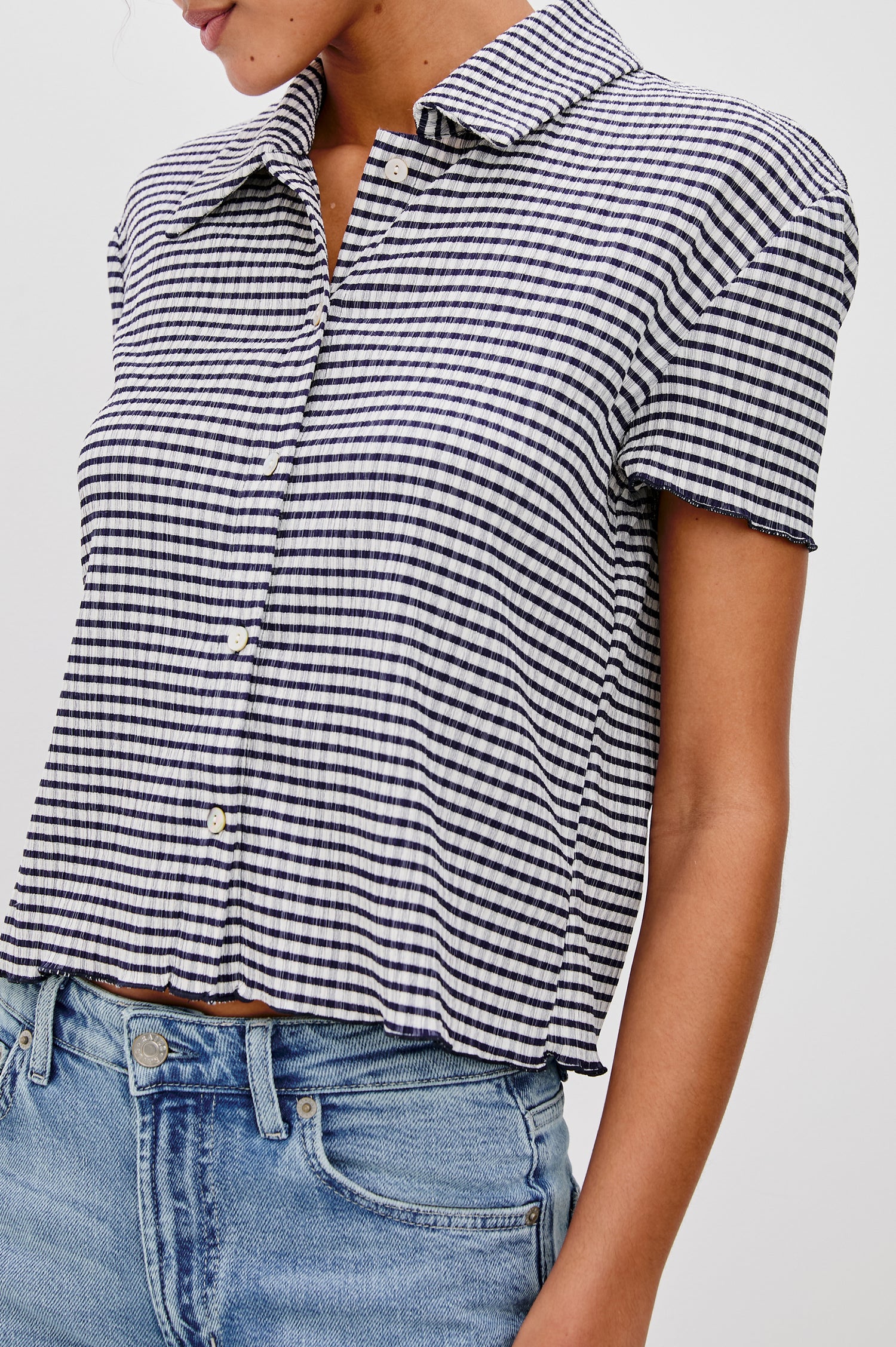 Limon Collared Button Front Shirt with Short Sleeves and Lettuce Hem in Navy Gingham Colorway. Detailed View Shown on Model.