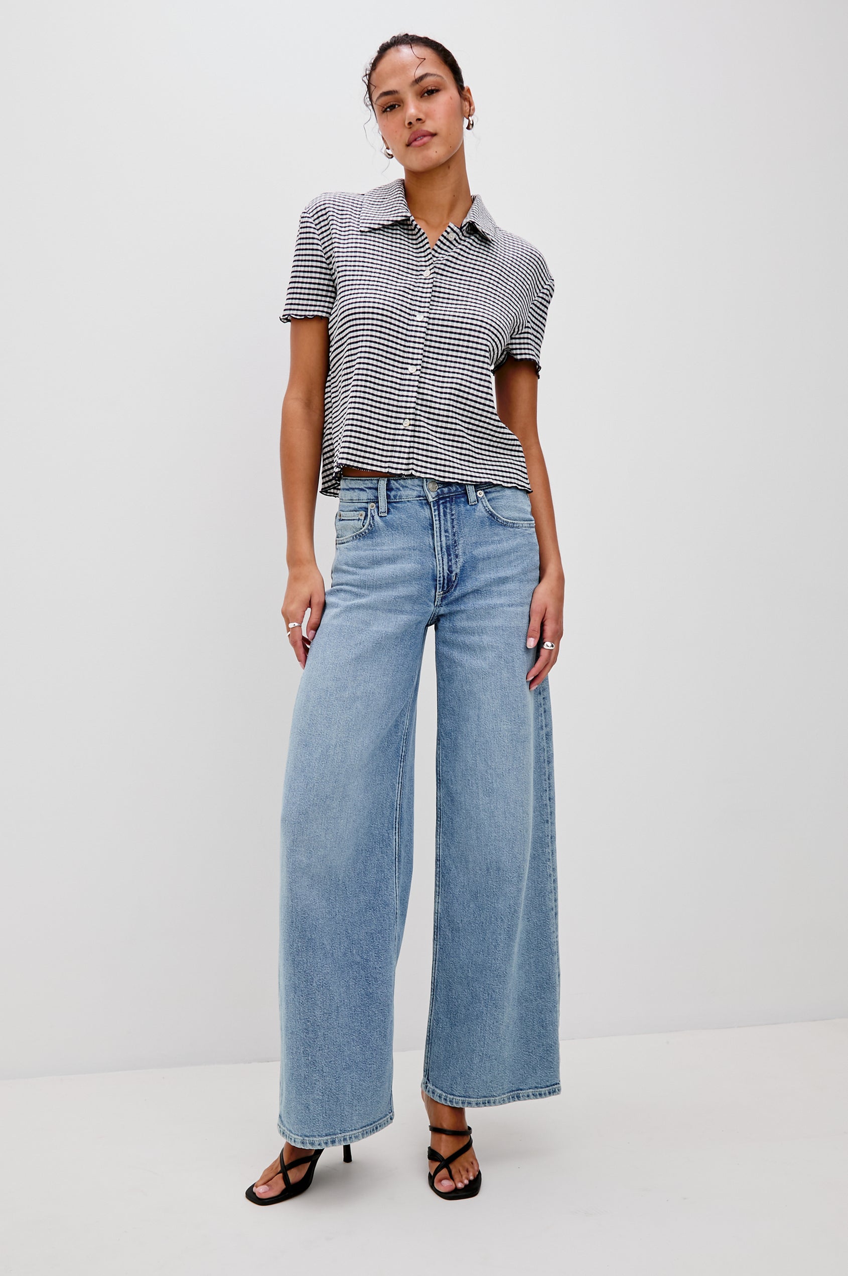 Limon Collared Button Front Shirt with Short Sleeves and Lettuce Hem in Navy Gingham Colorway. Front View Shown on Model.