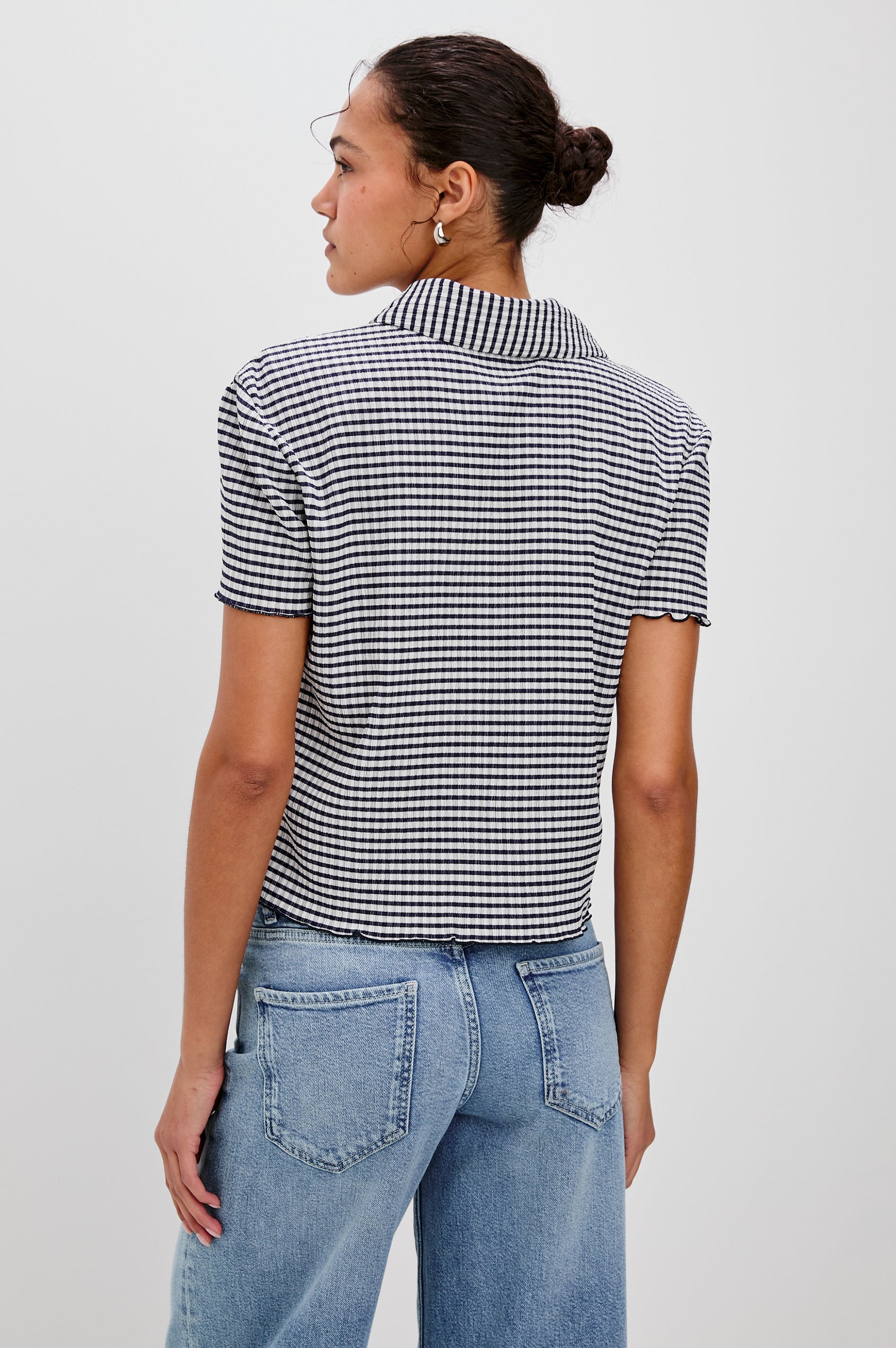 Limon Collared Button Front Shirt with Short Sleeves and Lettuce Hem in Navy Gingham Colorway. Back View Shown on Model.