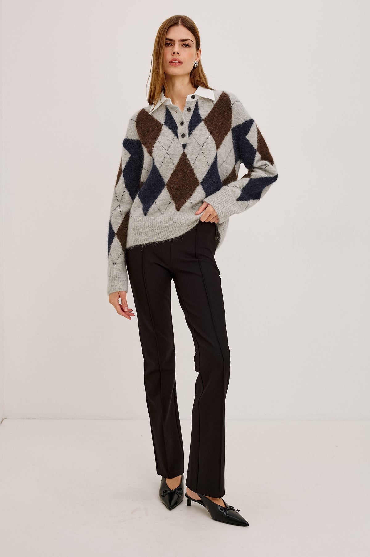 Linda Sweater in Alpaca Blend Knit With Contrast Polo Collar and Button Placket, Slightly Oversized Relaxed Fit, and Ribbed Trim in Cedar Argyle Colorway - Full Body Front View Featured on Model.