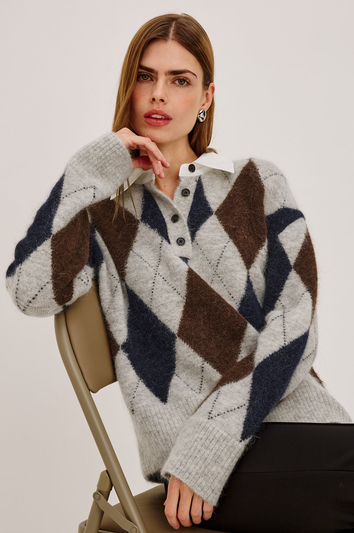 Linda Sweater in Alpaca Blend Knit With Contrast Polo Collar and Button Placket, Slightly Oversized Relaxed Fit, and Ribbed Trim in Cedar Argyle Colorway - Front View Featured on Model.