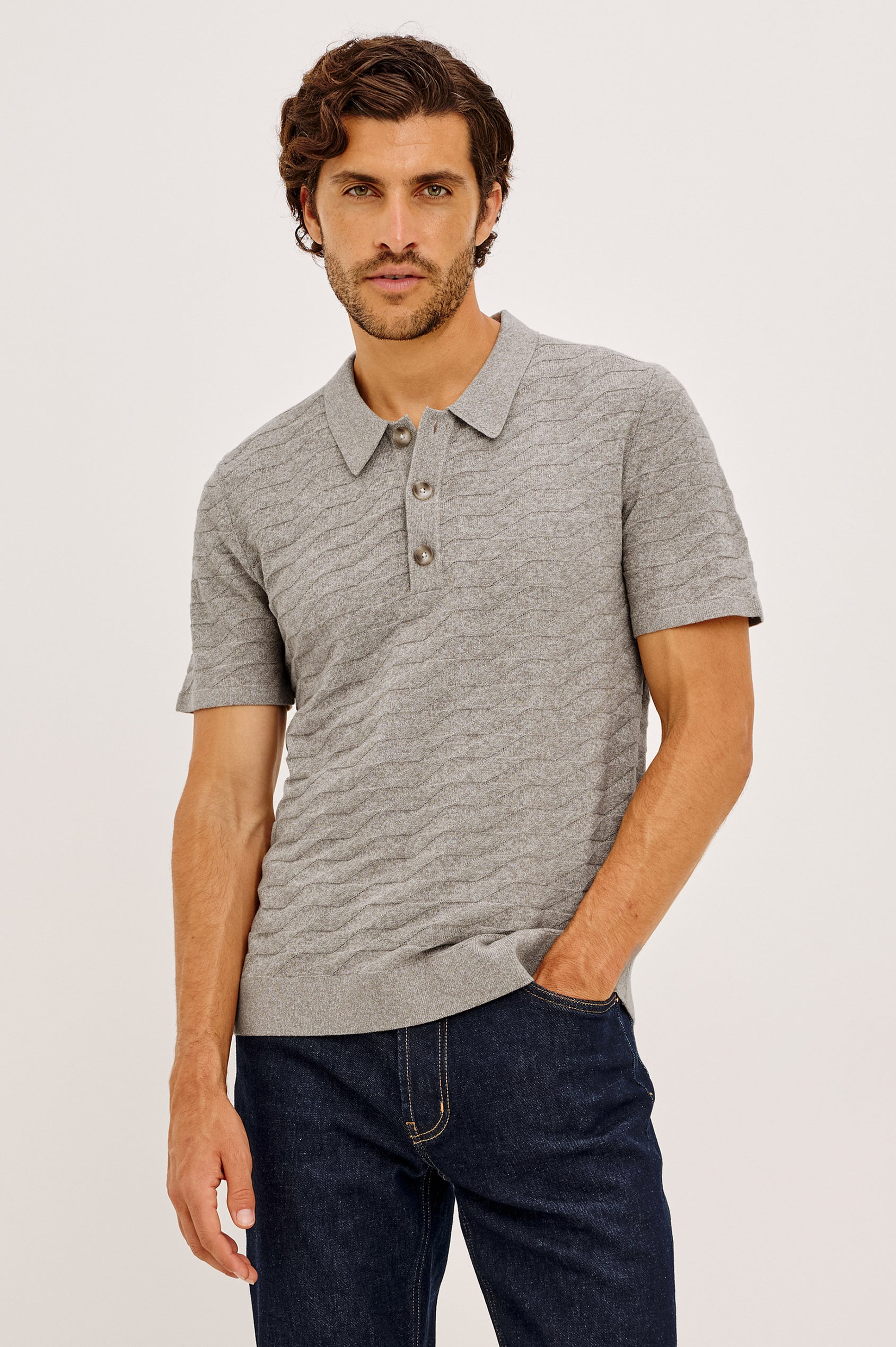 Linden Polo Shirt in Cotton Knit With Subtle Diamond Texture, Classic Fit, Quarter Button Placket, Short Sleeves, and Ribbed Trim in Heather Grey Prism Colorway - Upper Body Front View Featured on Model