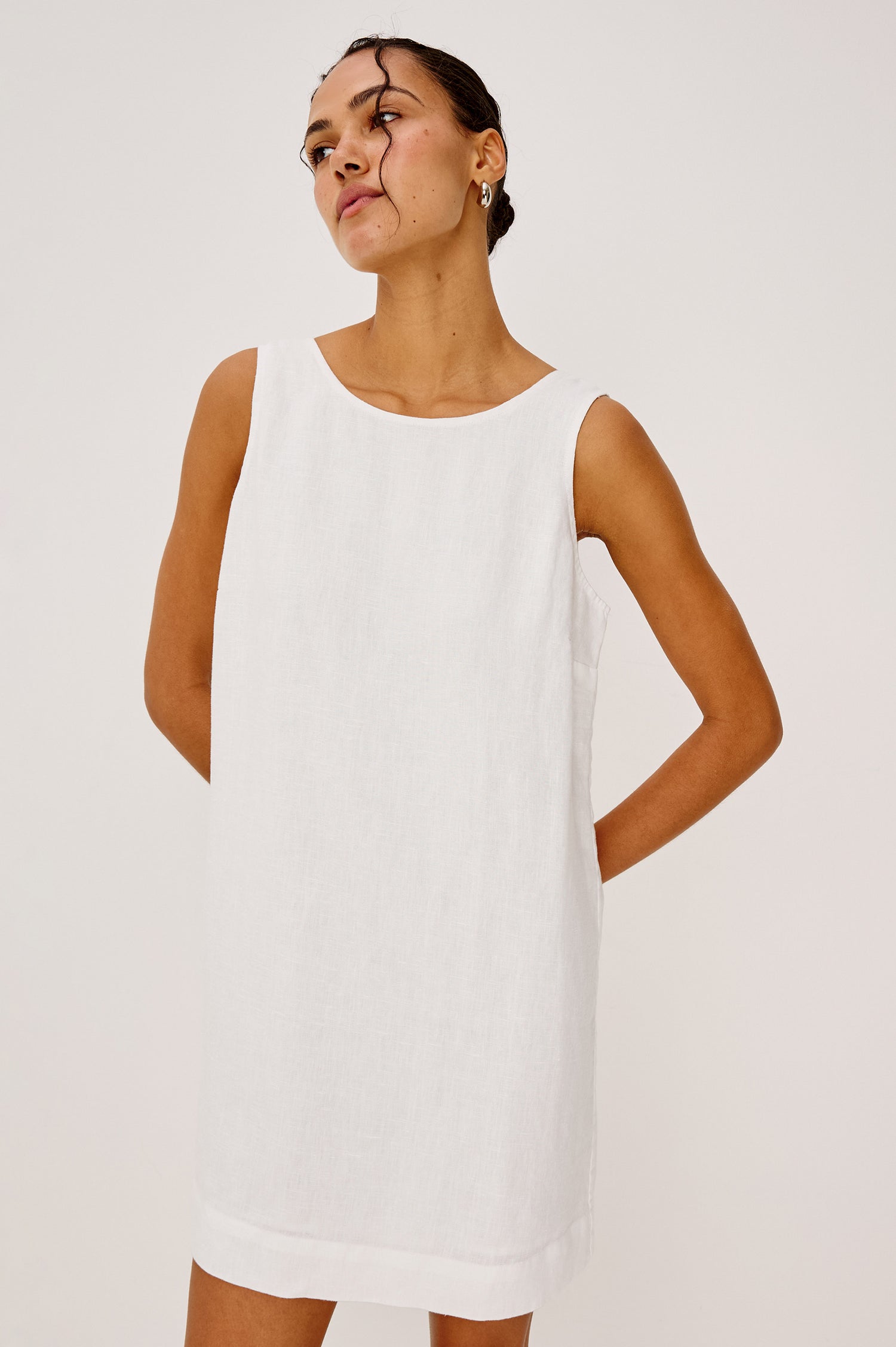 Lindsey Sleeveless Scoop Neck Mini Dress in White Colorway. Front View Shown on Model.