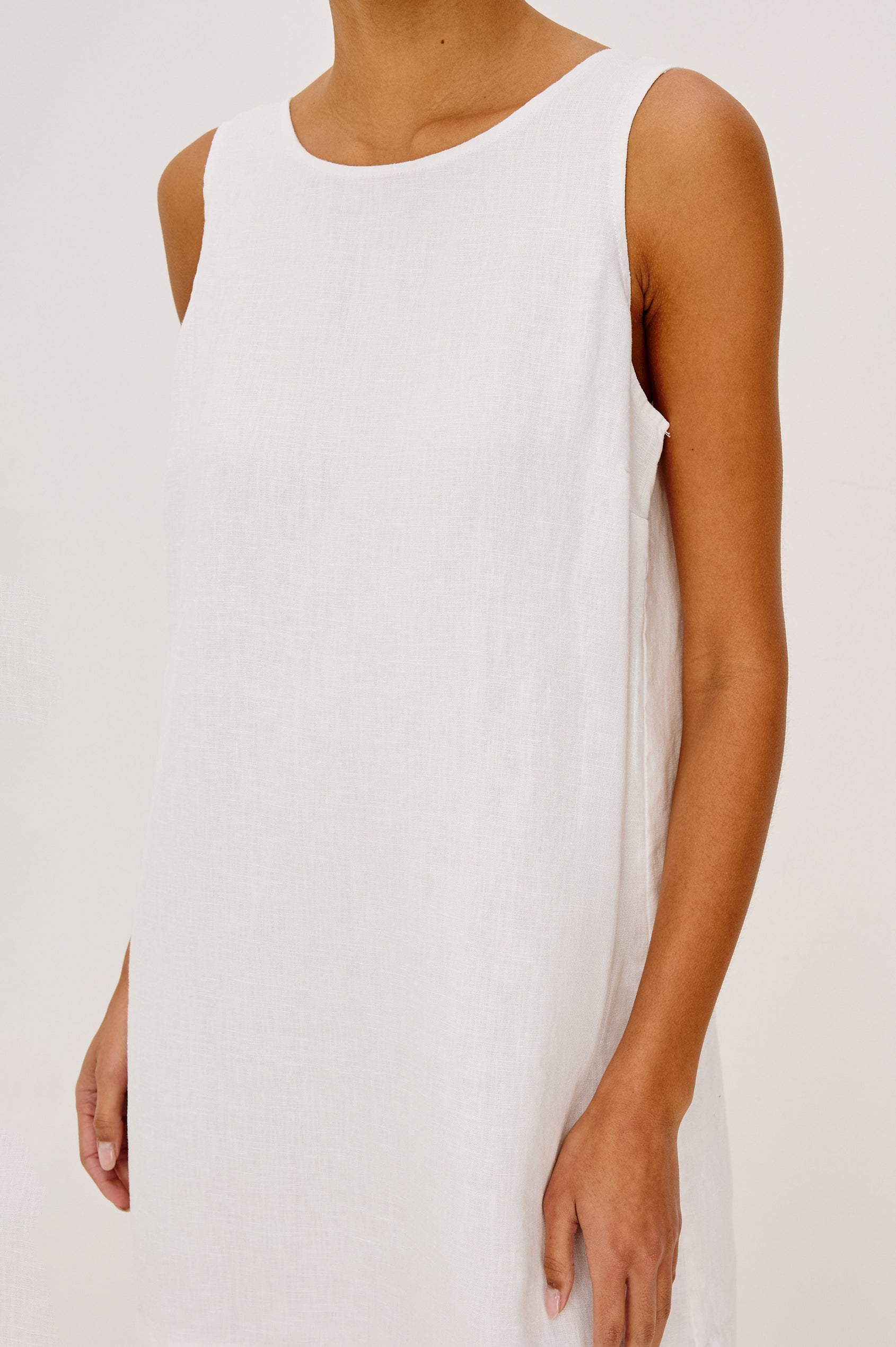 Lindsey Sleeveless Scoop Neck Mini Dress in White Colorway. Front View Shown on Model.