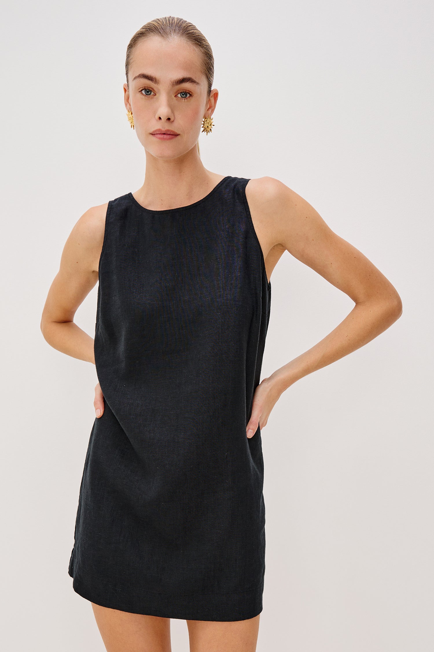 Lindsey Sleeveless Scoop Neck Mini Dress in Black Colorway. Front View Shown on Model.