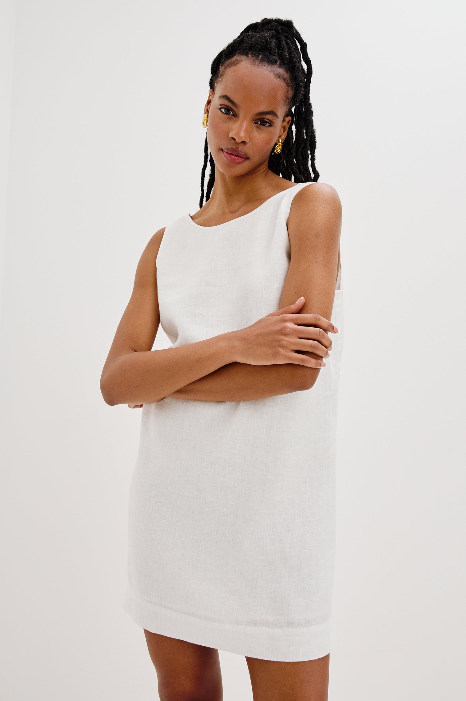 Lindsey Sleeveless Scoop Neck Mini Dress in White Colorway. Front View Shown on Model.