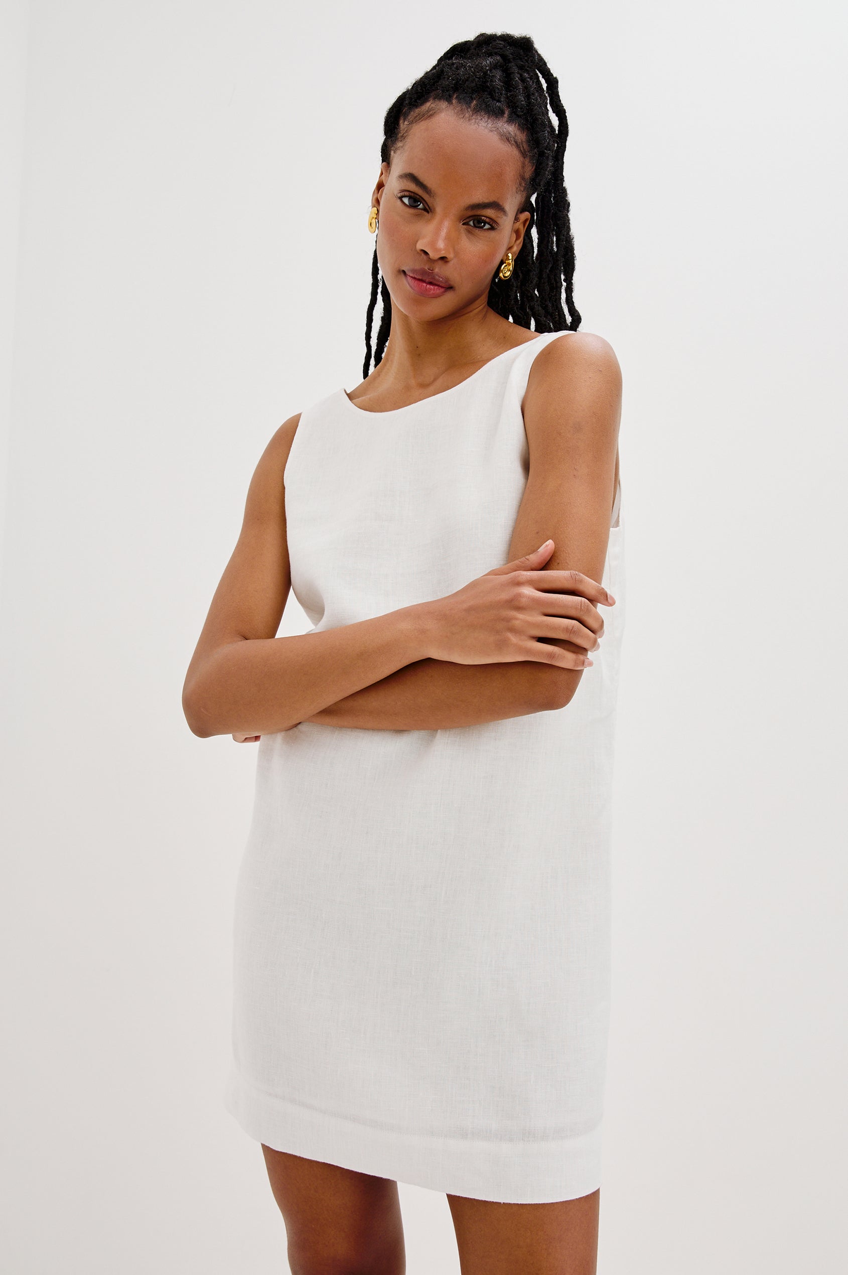 Lindsey Sleeveless Scoop Neck Mini Dress in White Colorway. Front View Shown on Model.