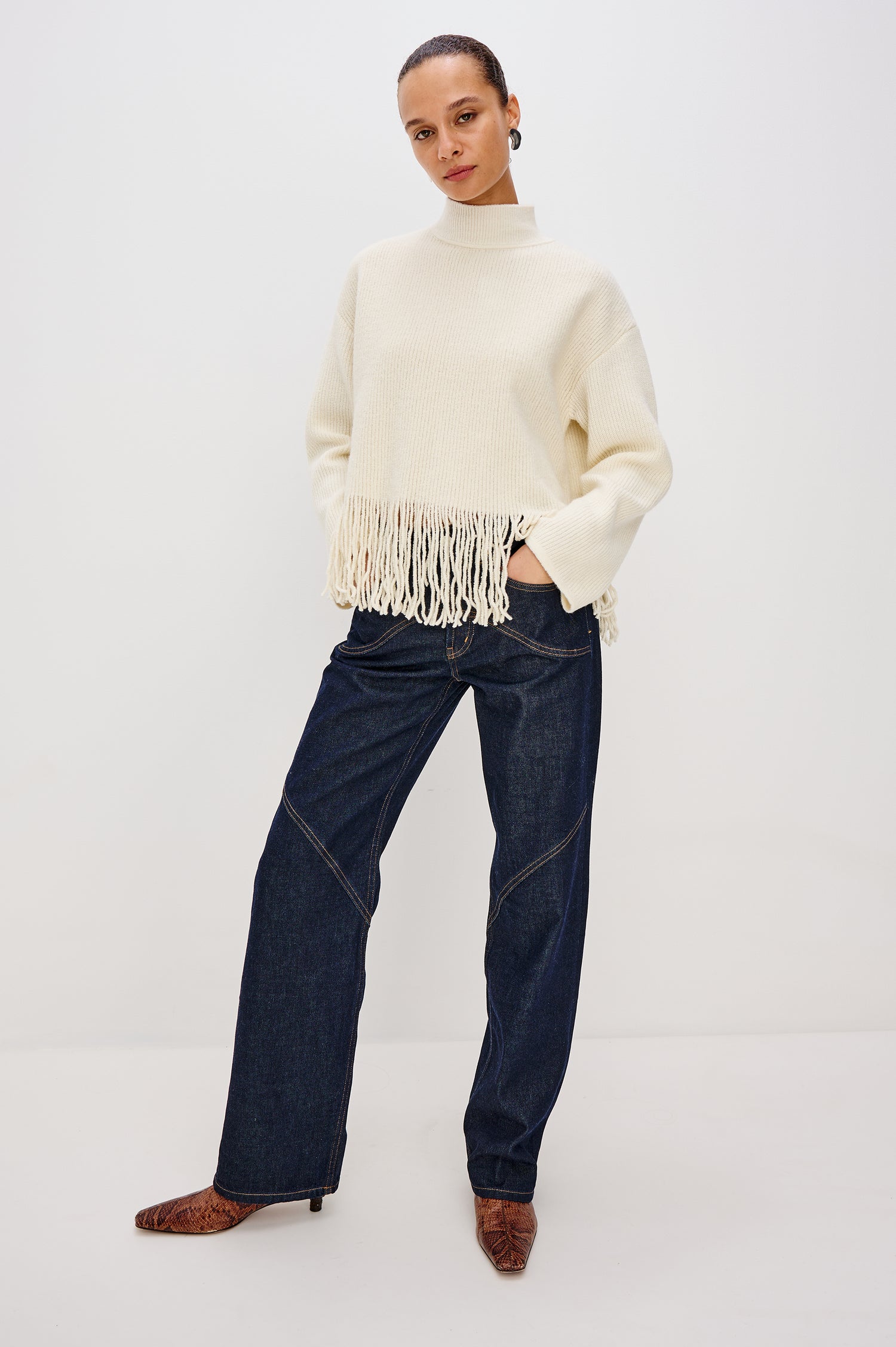 Lise Turtleneck Sweater in Ribbed Wool Blend With Long Sleeves and Ribbed Trim - Ivory Fringe Colorway - Upper Body Close Up Front View Featured on Model