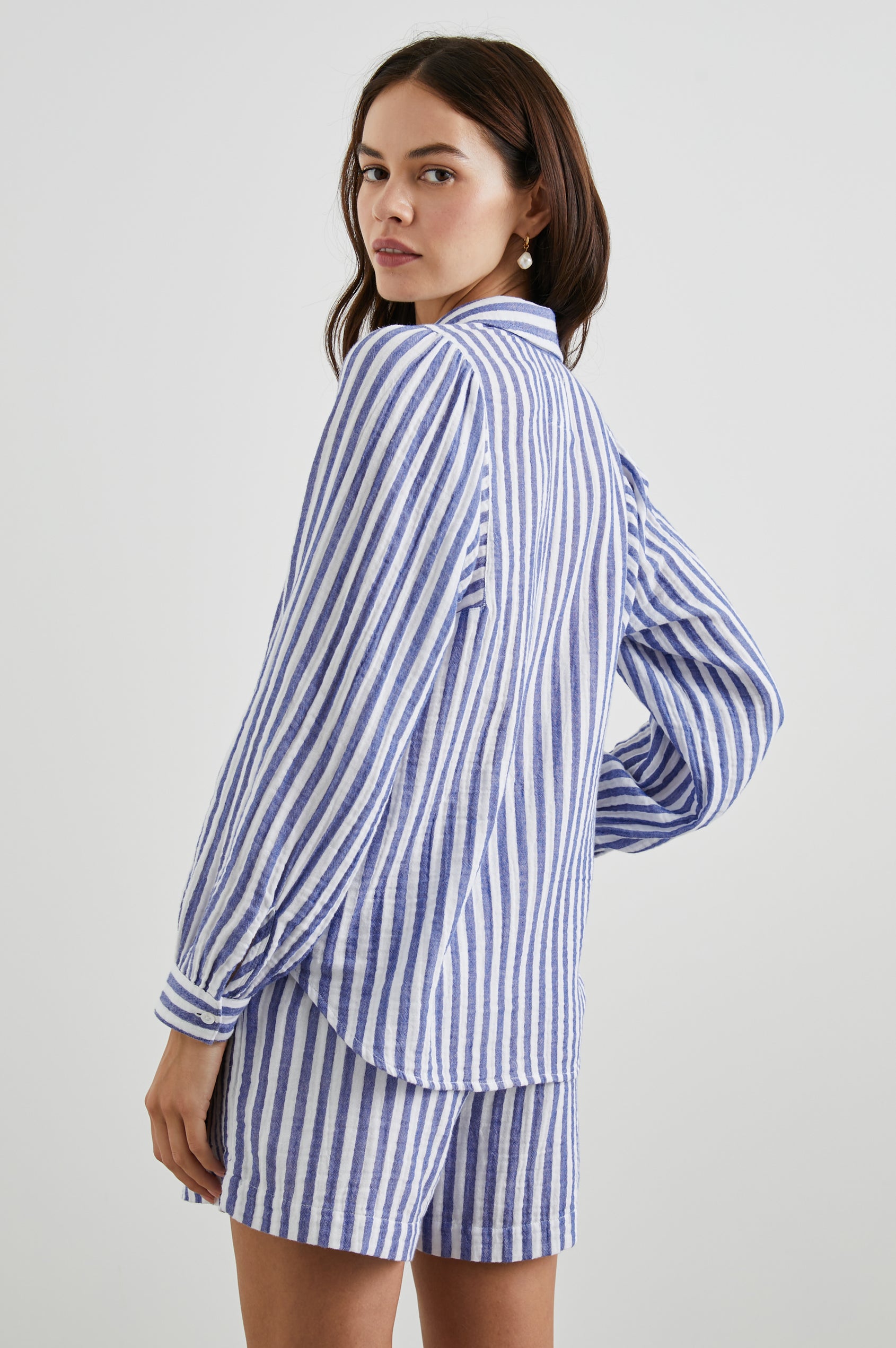 Lo Long-Sleeve Button Up with a V Neck in Anacapa Stripe Colorway, Blue and White Vertical Stripes - Back View Featured on Model