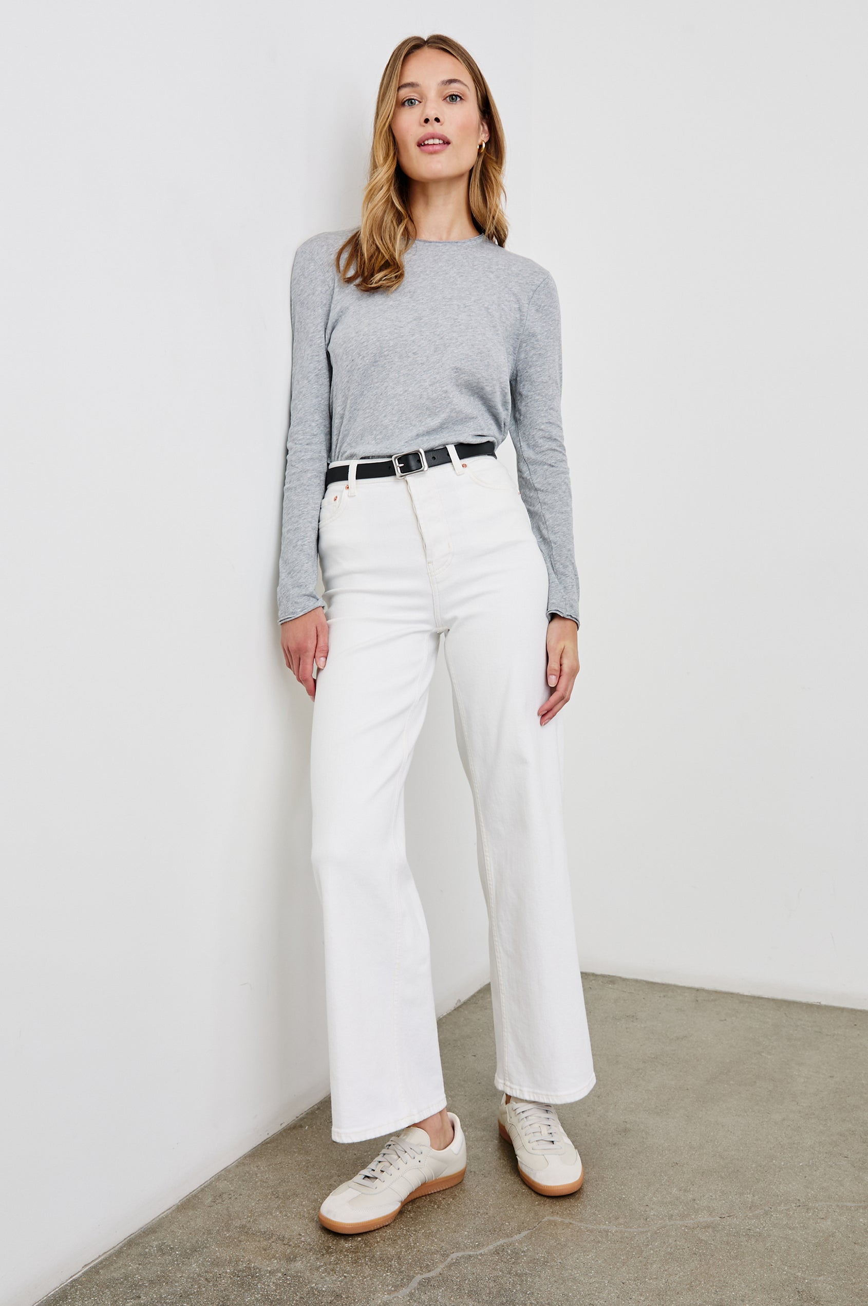 Long Sleeve Crew Neck T Shirt with Raw Hem, Collar and Cuffs in Heather Grey Colorway - Front Full Body View Featured on Model