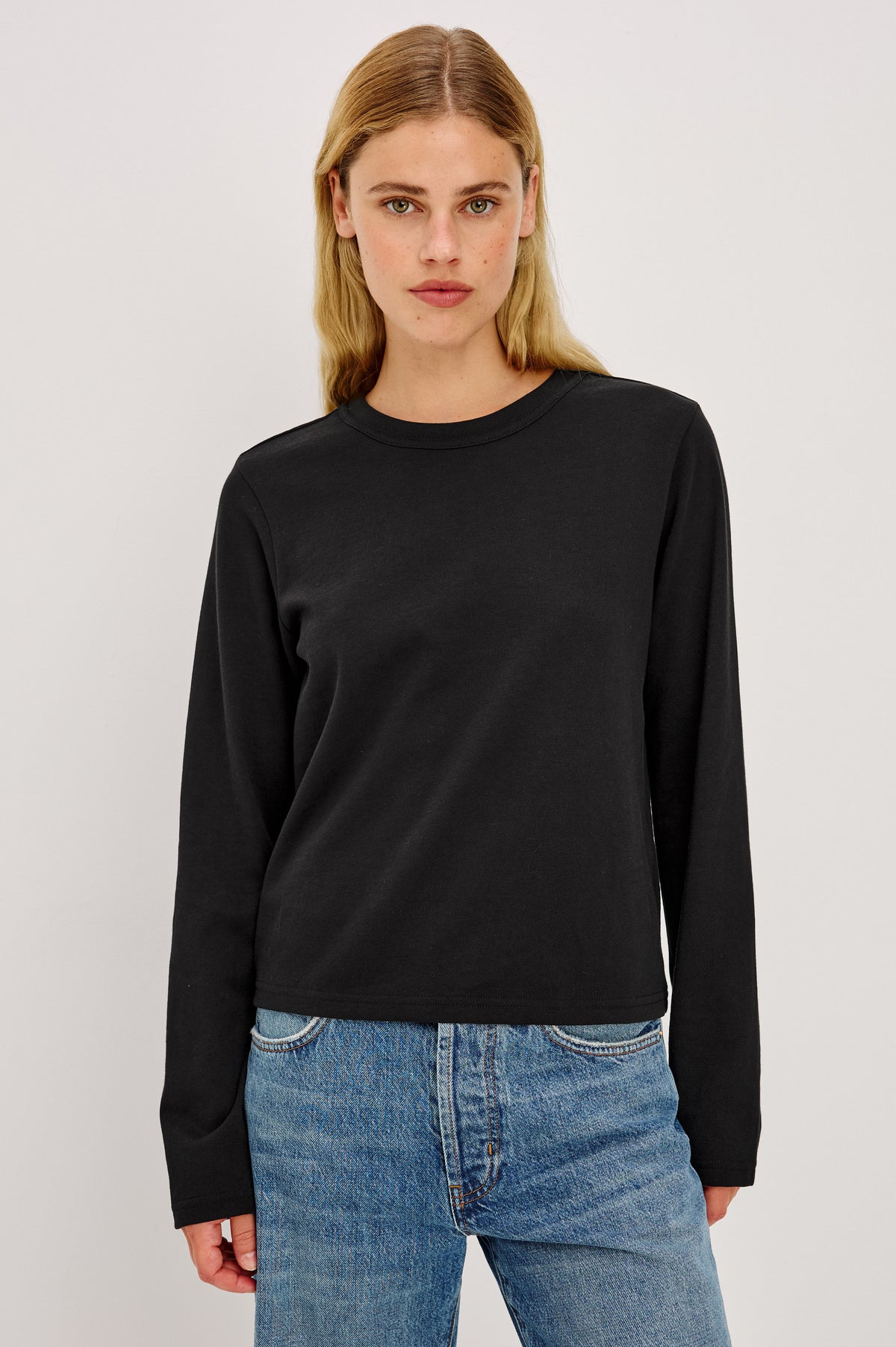 Long Sleeve Girlfriend Tee in Midweight Pleated Jersey in Slightly Boxy Cropped Fit With Crew Neckline in Black Colorway - Front Crop View Featured on Model.