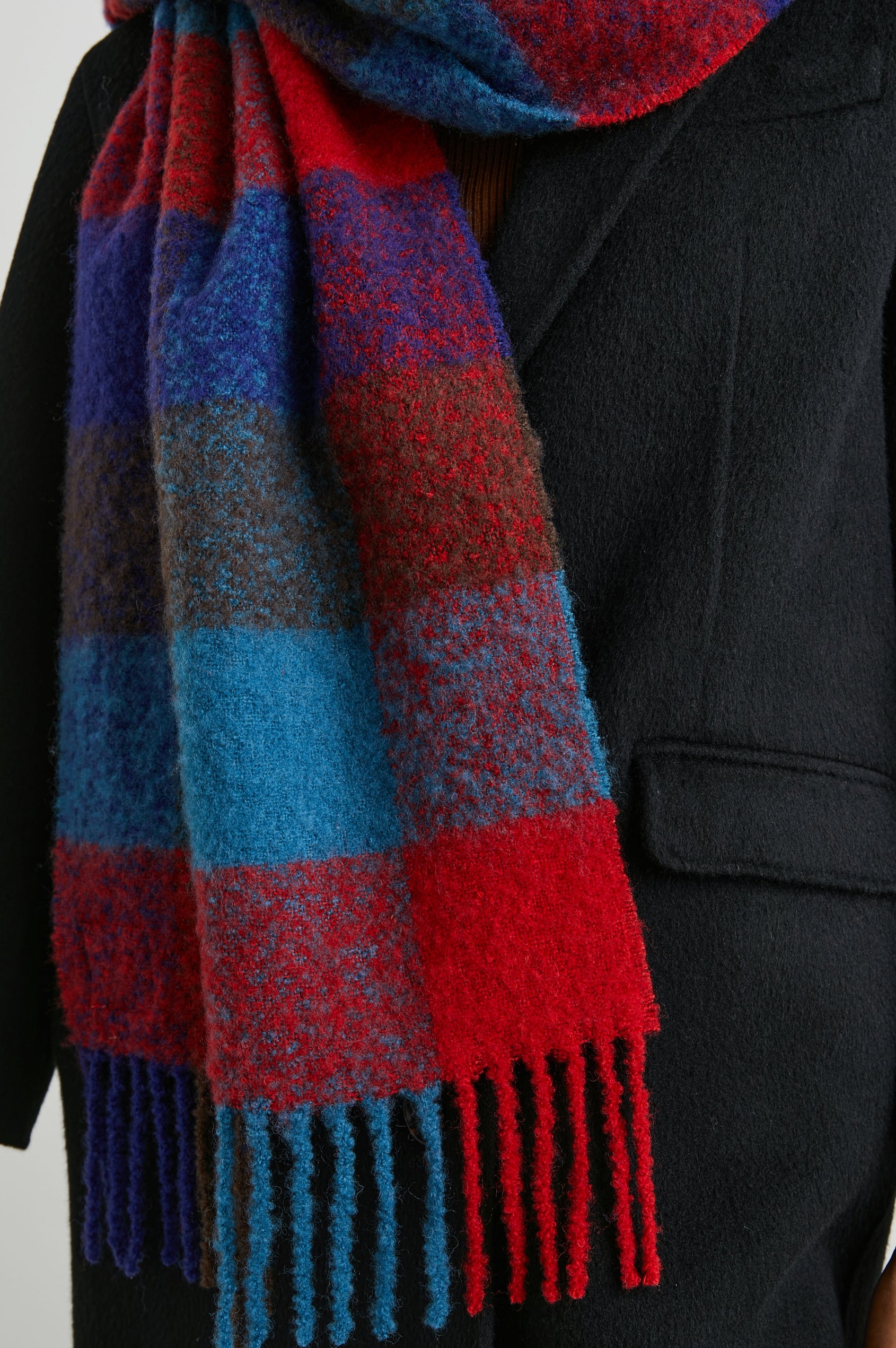Lora Scarf with a Checkered Pattern and Tassels in Crimson Espresso Colorway, with Crimson, Espresso and Blue - Front View Featured on Model
