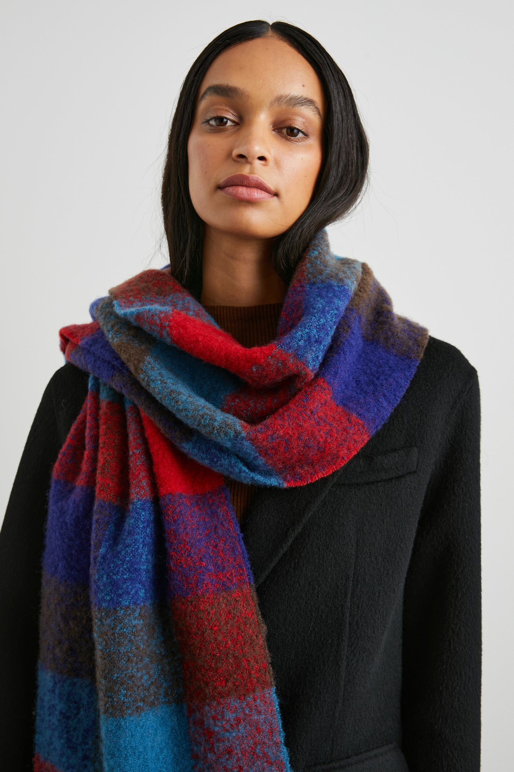 Lora Scarf with a Checkered Pattern and Tassels in Crimson Espresso Colorway, with Crimson, Espresso and Blue - Front View Featured on Model